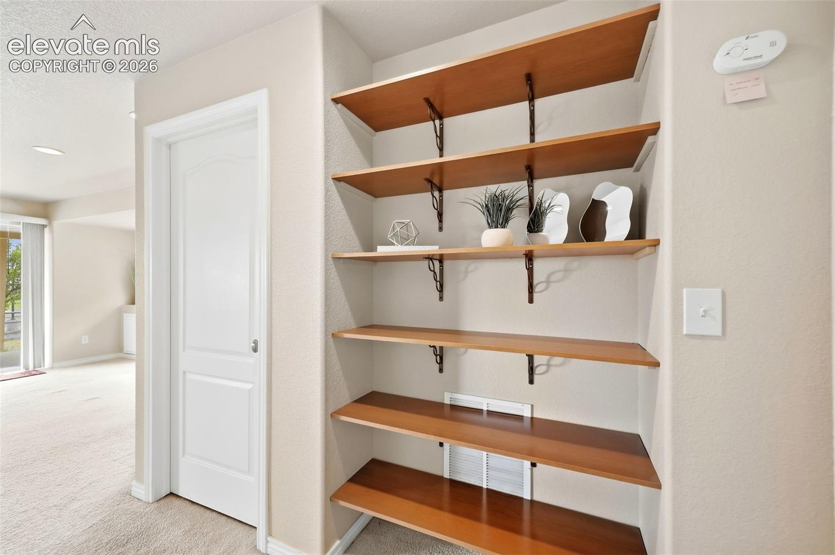 Built in shelving in basement hall
