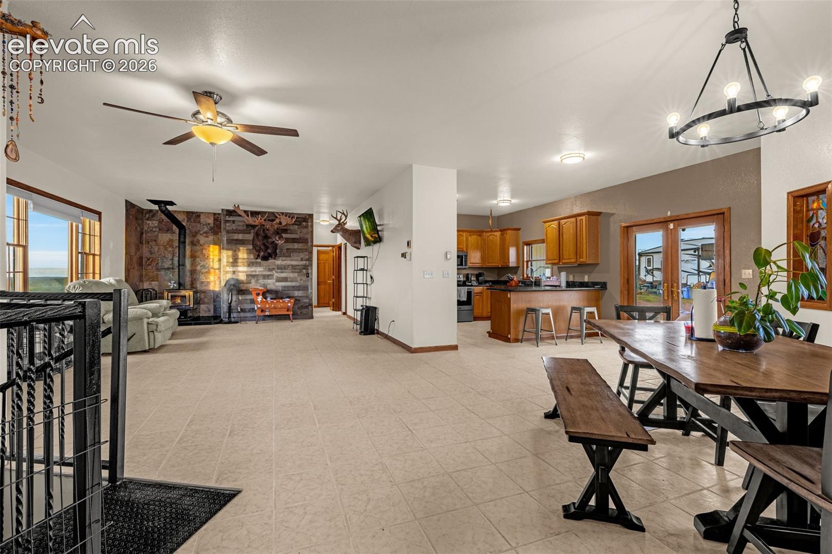 Spacious open-concept interior featuring light-toned flooring