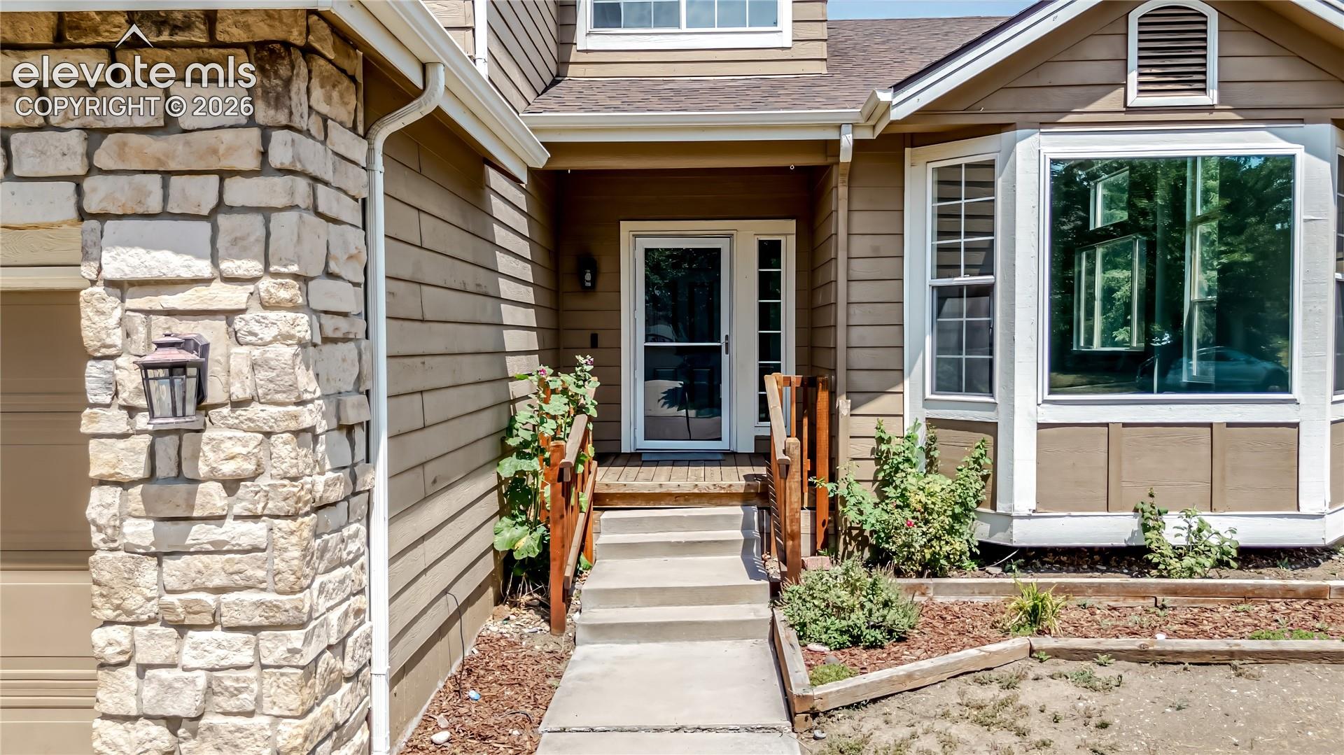 Stone veneer accents a siding exterior