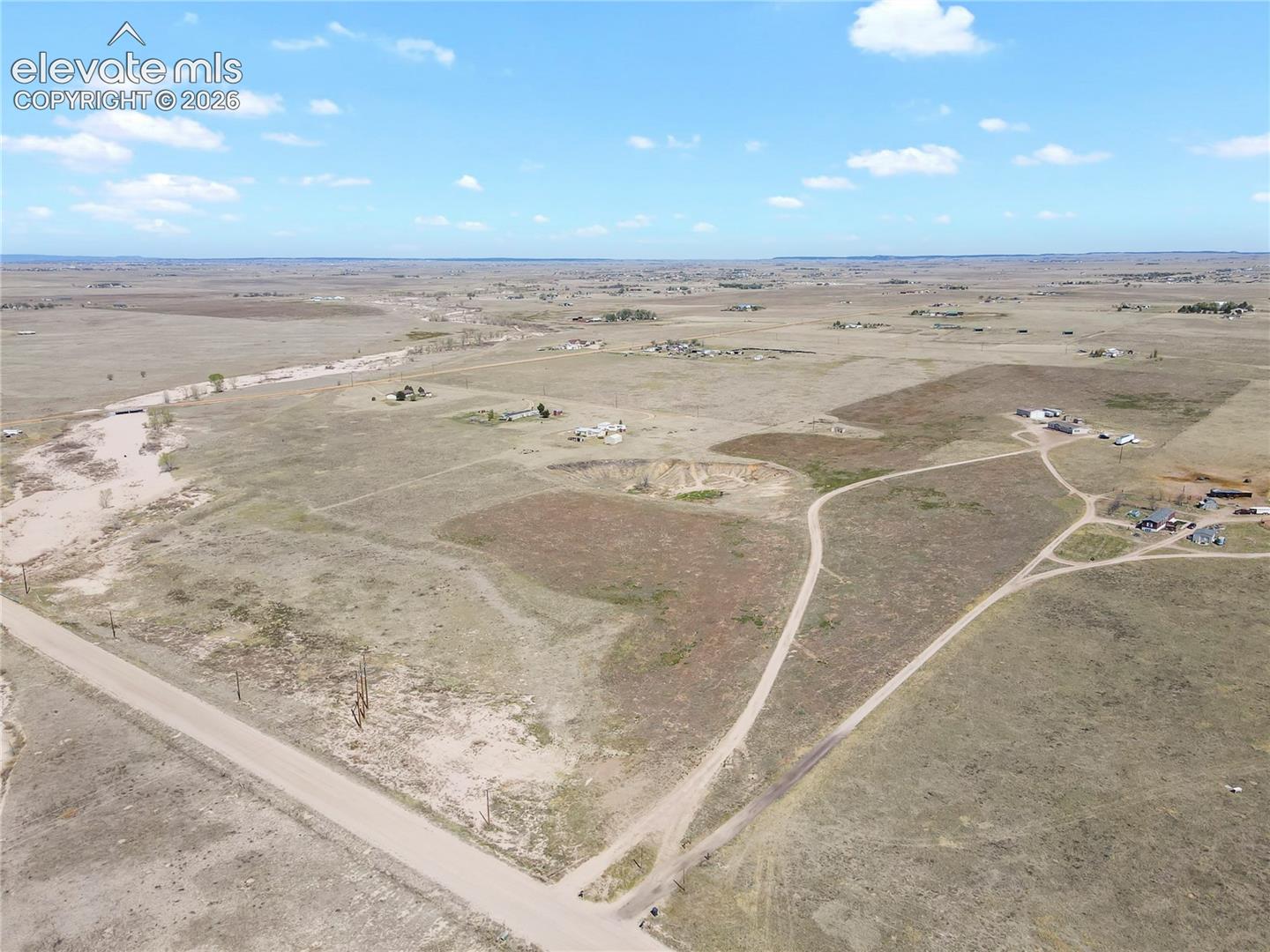 Expansive acreage featuring natural terrain and dirt road access