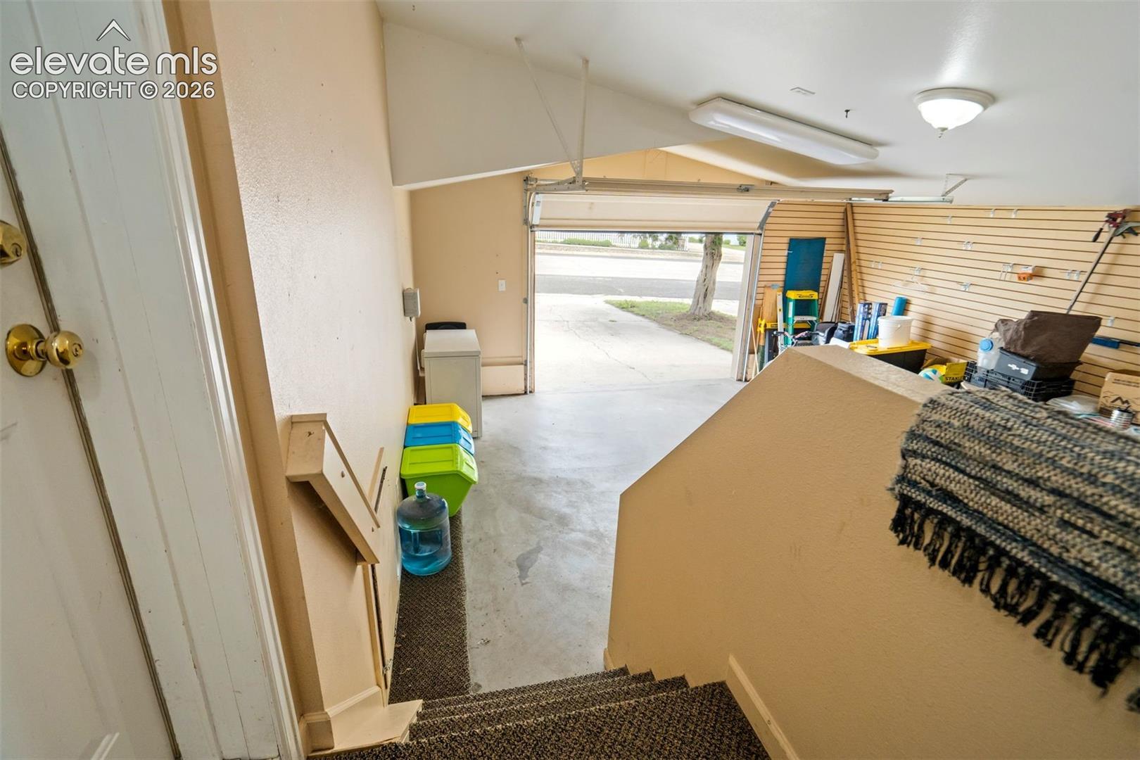 Attached oversized garage offers excellent space for parking, storage, hobbies, or workshop use.