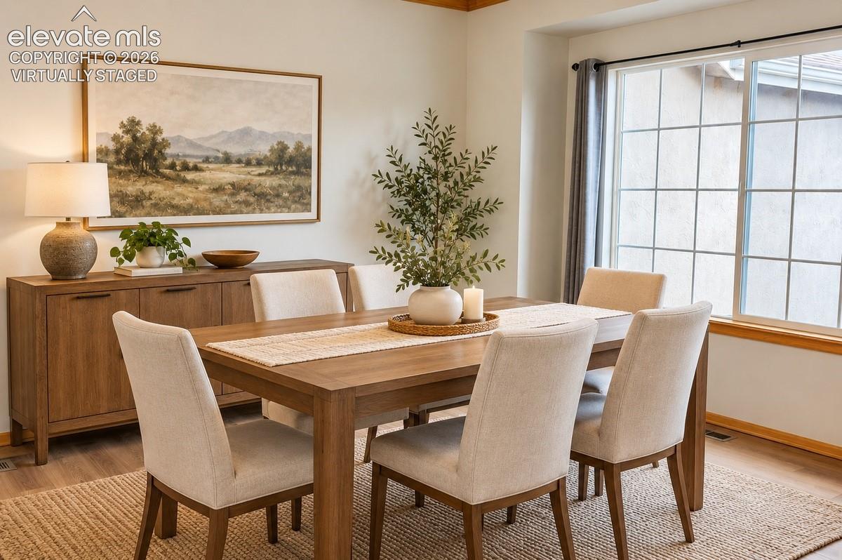 Wood-finish flooring, off the kitchen area with bright windows. Virtually Staged.