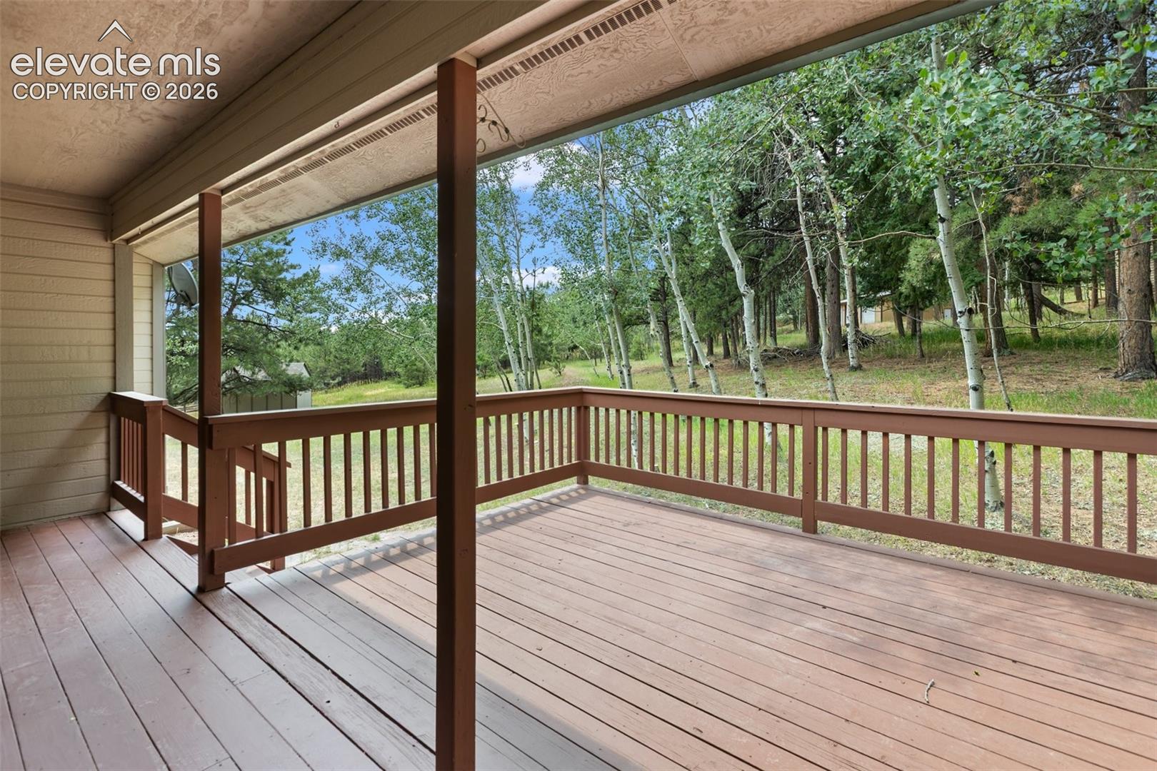 Back yard and deck for relaxing evening and peaceful mornings!