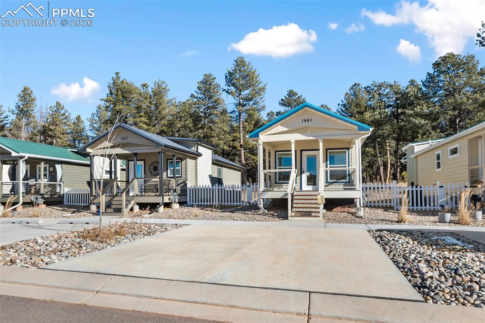 Front of house and parking. 