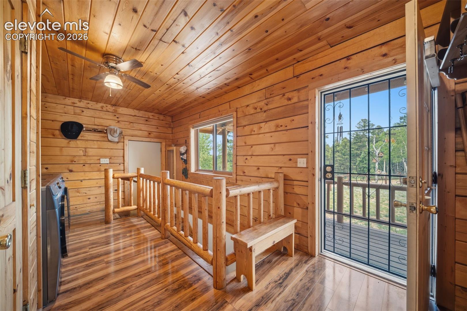 Main level entry with rustic log railing