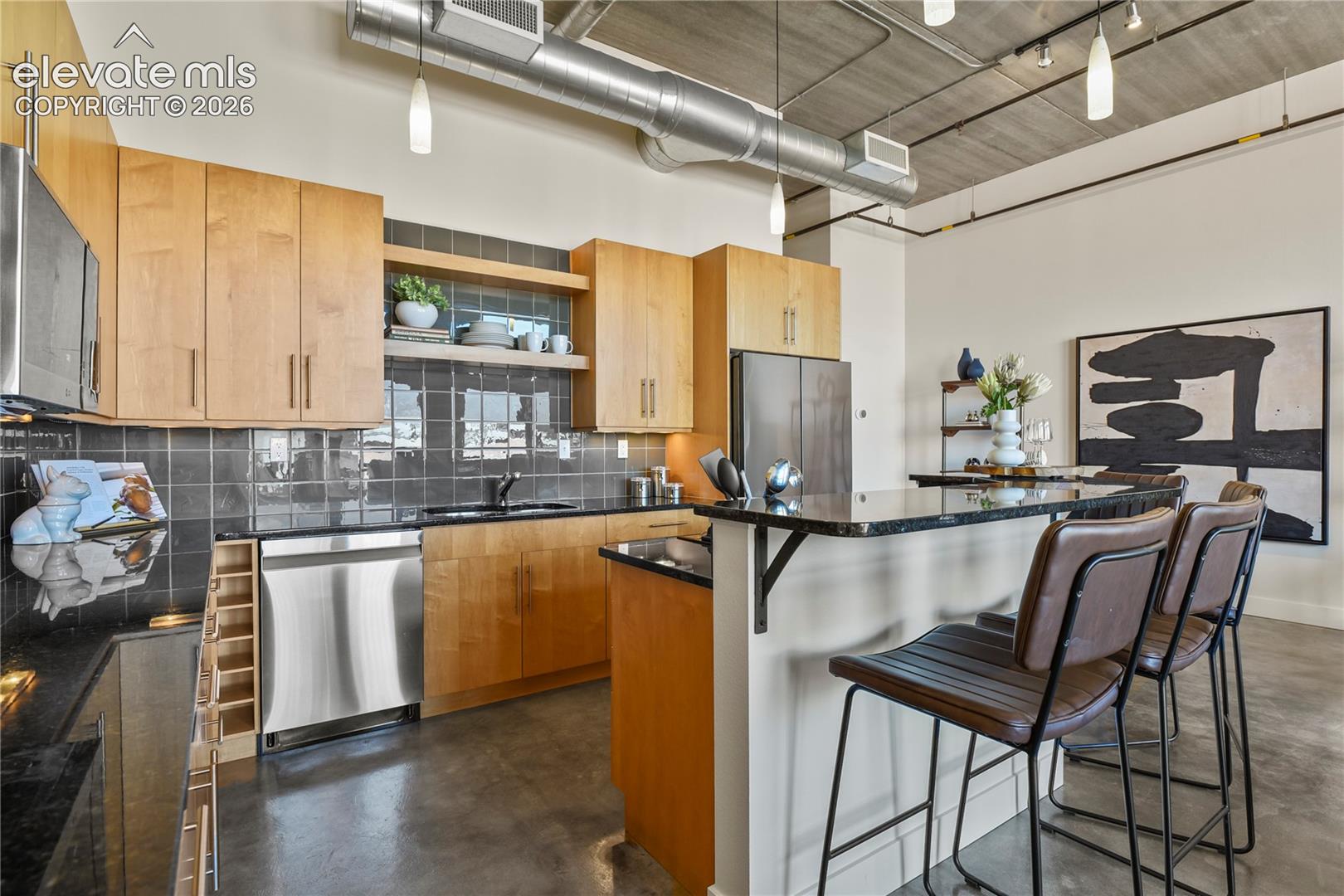 Center raised bar island with informal seating for 4