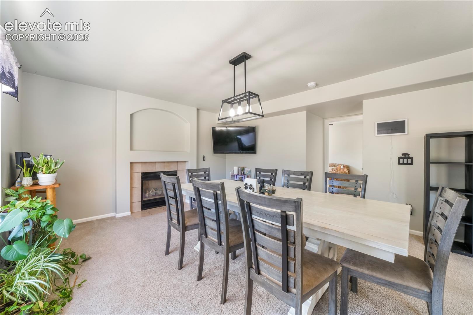 Currently staged as dining area, also family room with gas fireplace
