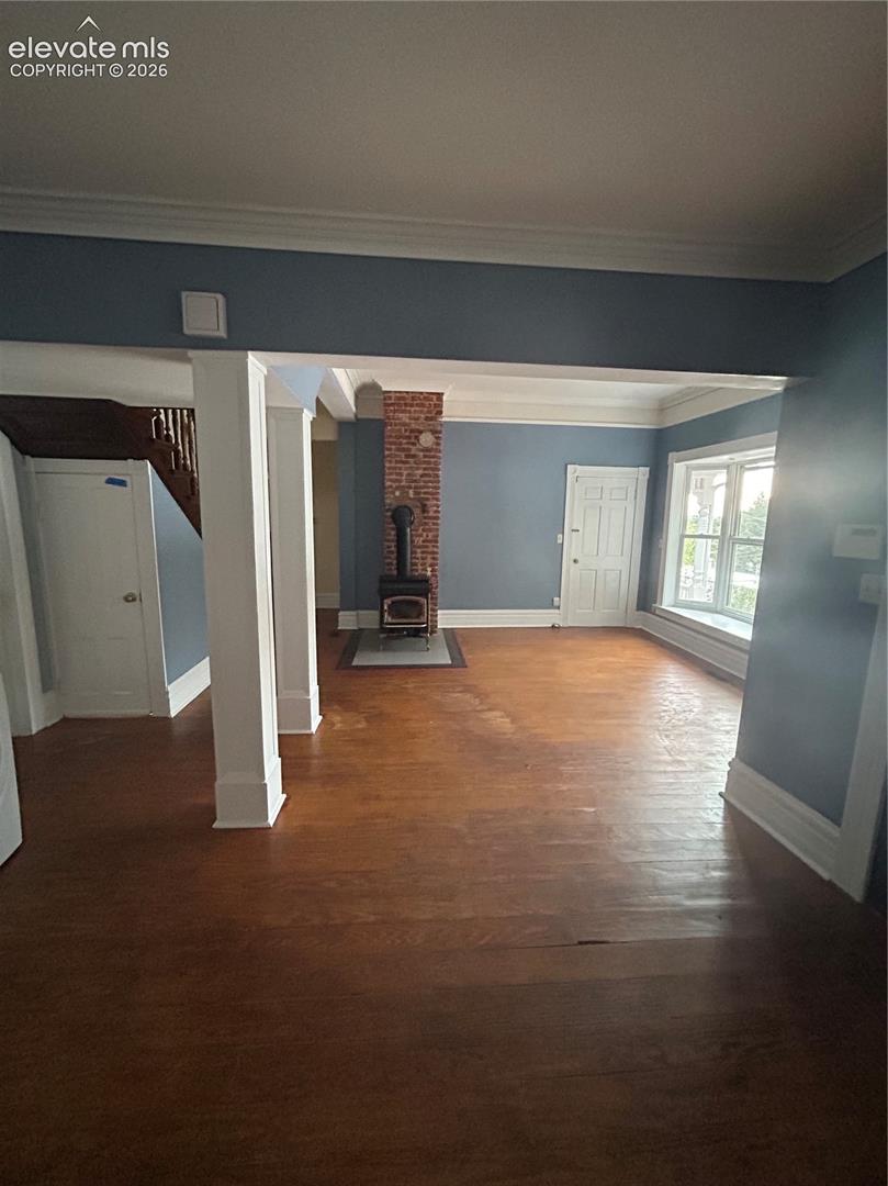 Main House/602: Living room area with wood burning fireplace