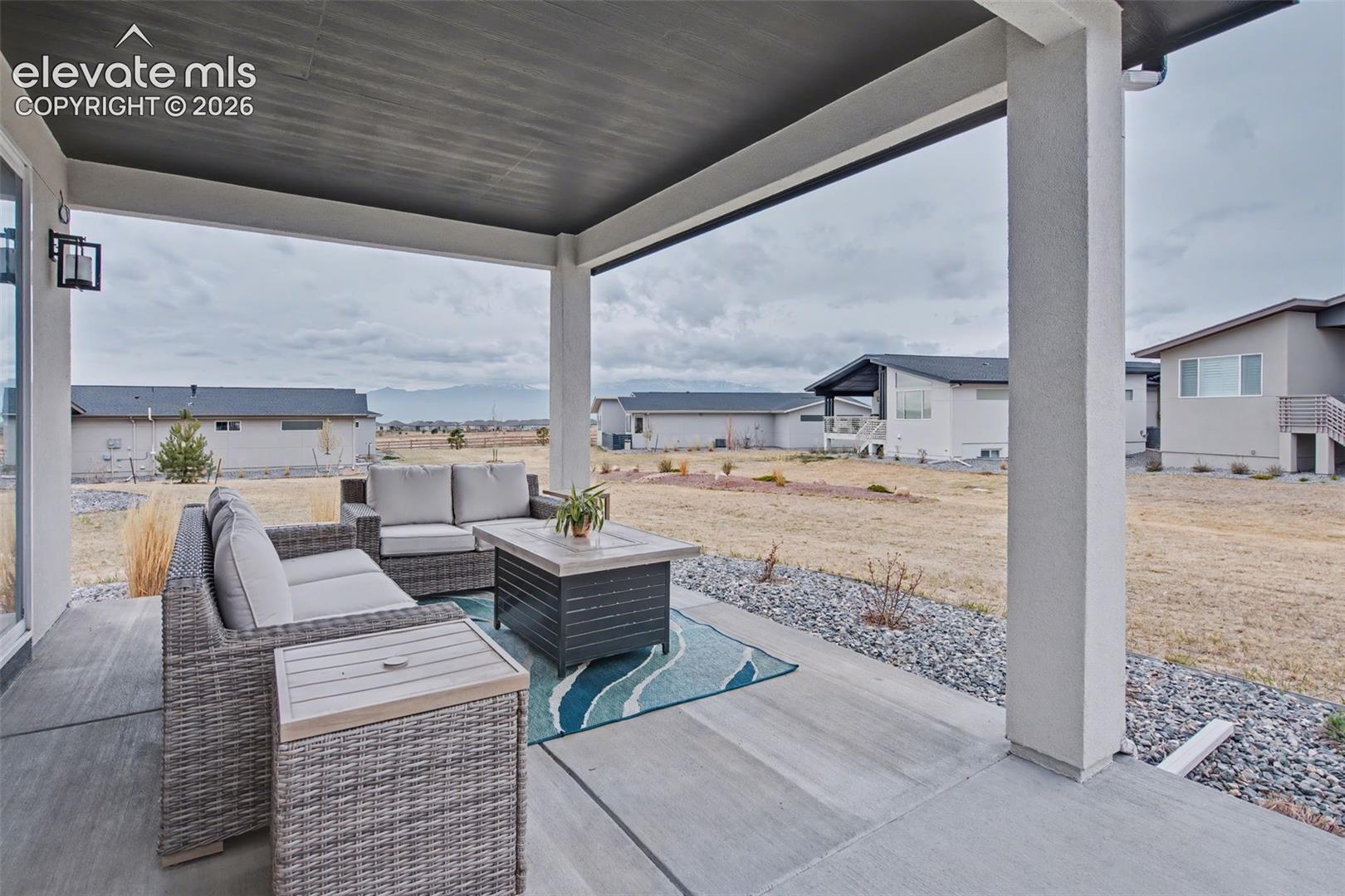 View of patio with a residential view and an outdoor hangout area