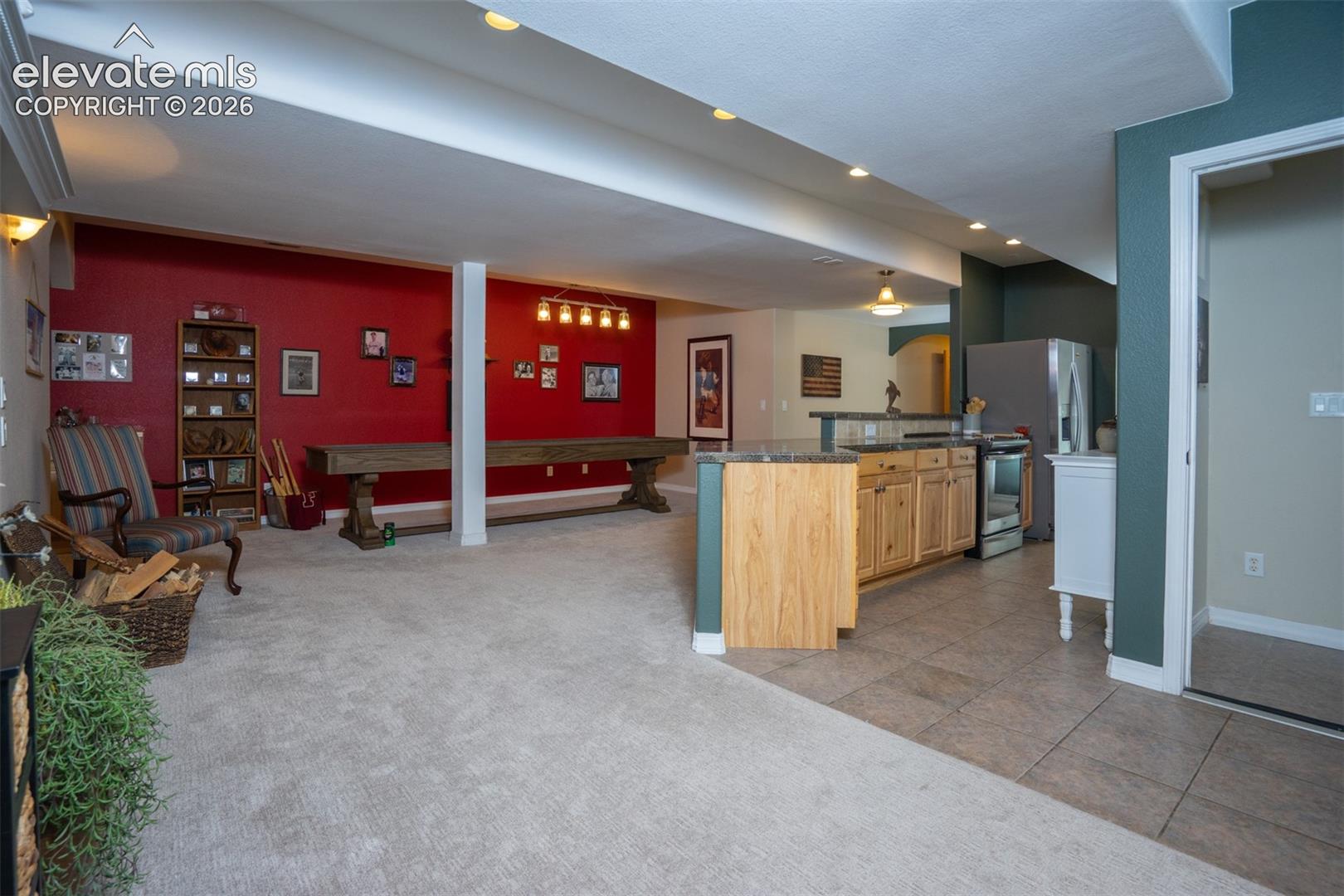 A look from the sitting area into the kitchen and dining area of the basement apartment