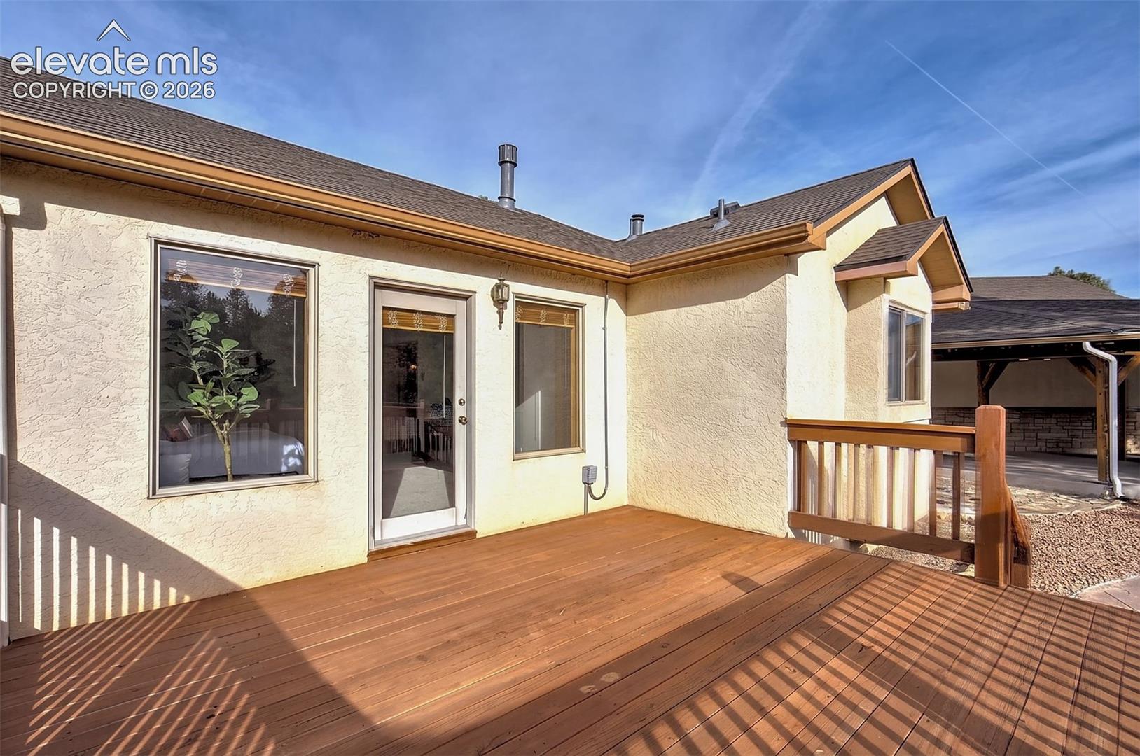 Redwood deck off of the primary bedroom