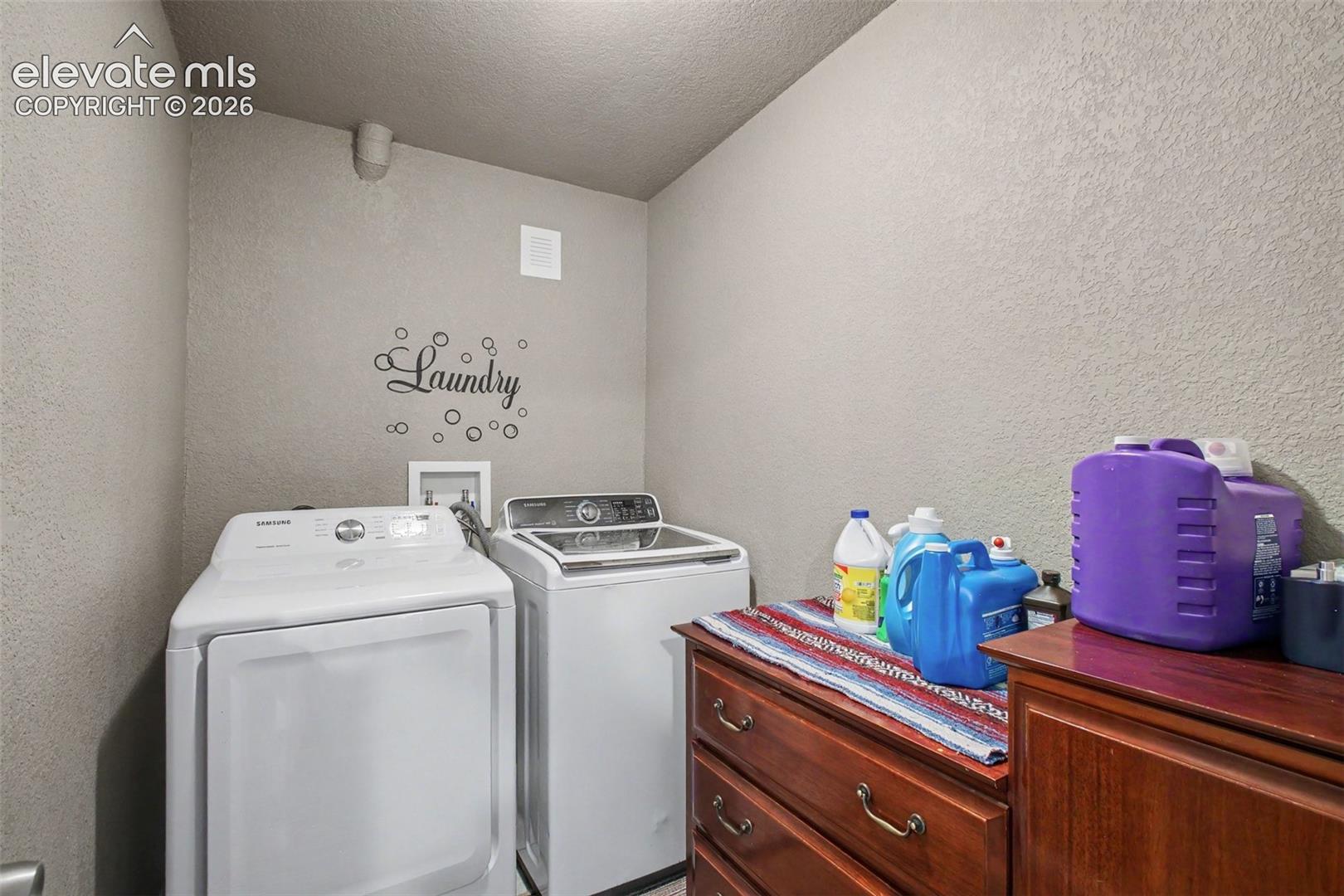 Convenient laundry room with practical space for everyday chores and storage.