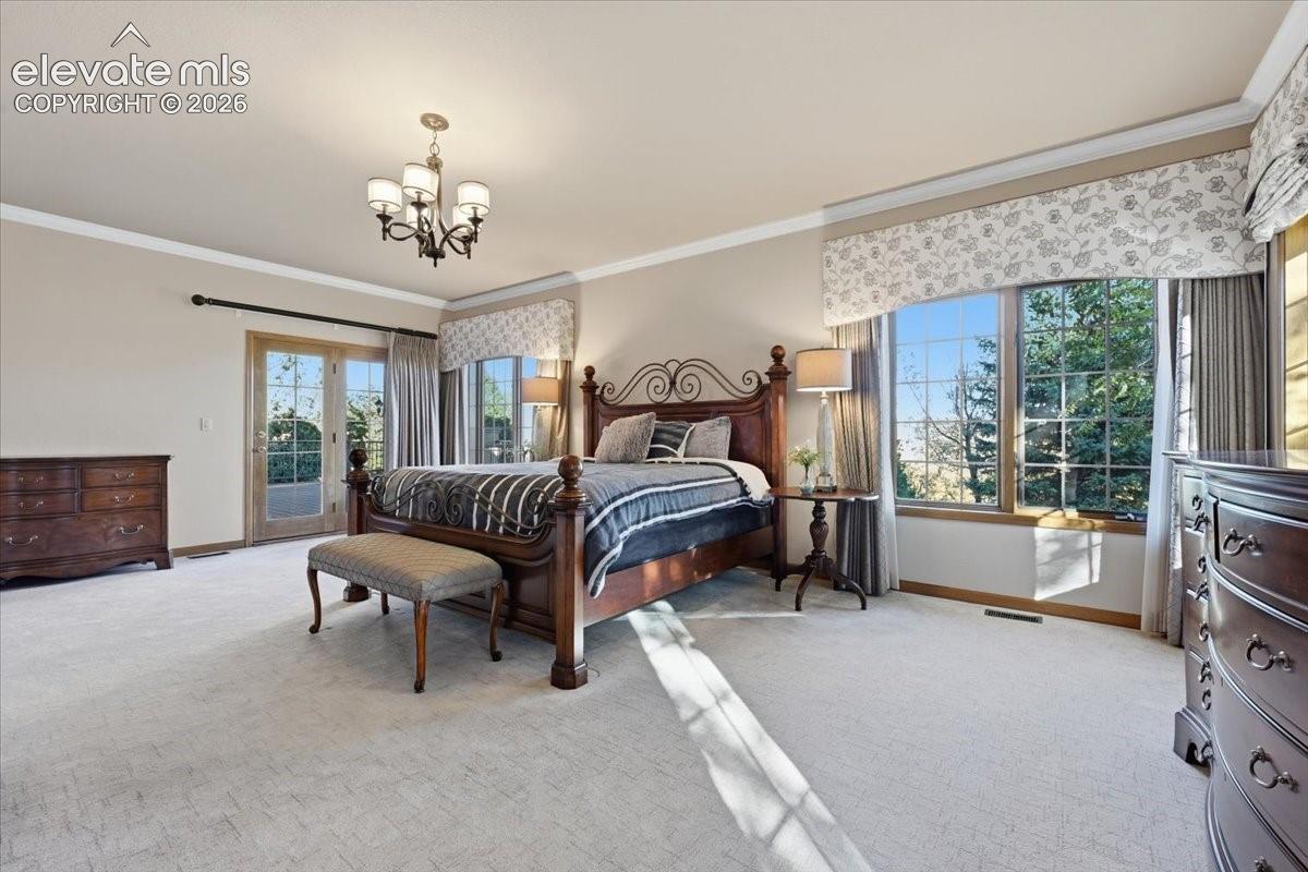 This expansive room offers a private bath and a walkout to the covered deck. 