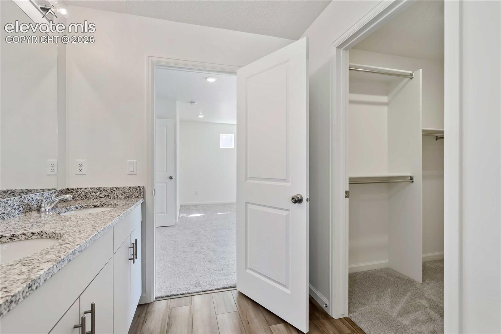 Dual vanity with integrated sinks and granite-style countertop
*photos of a model home*