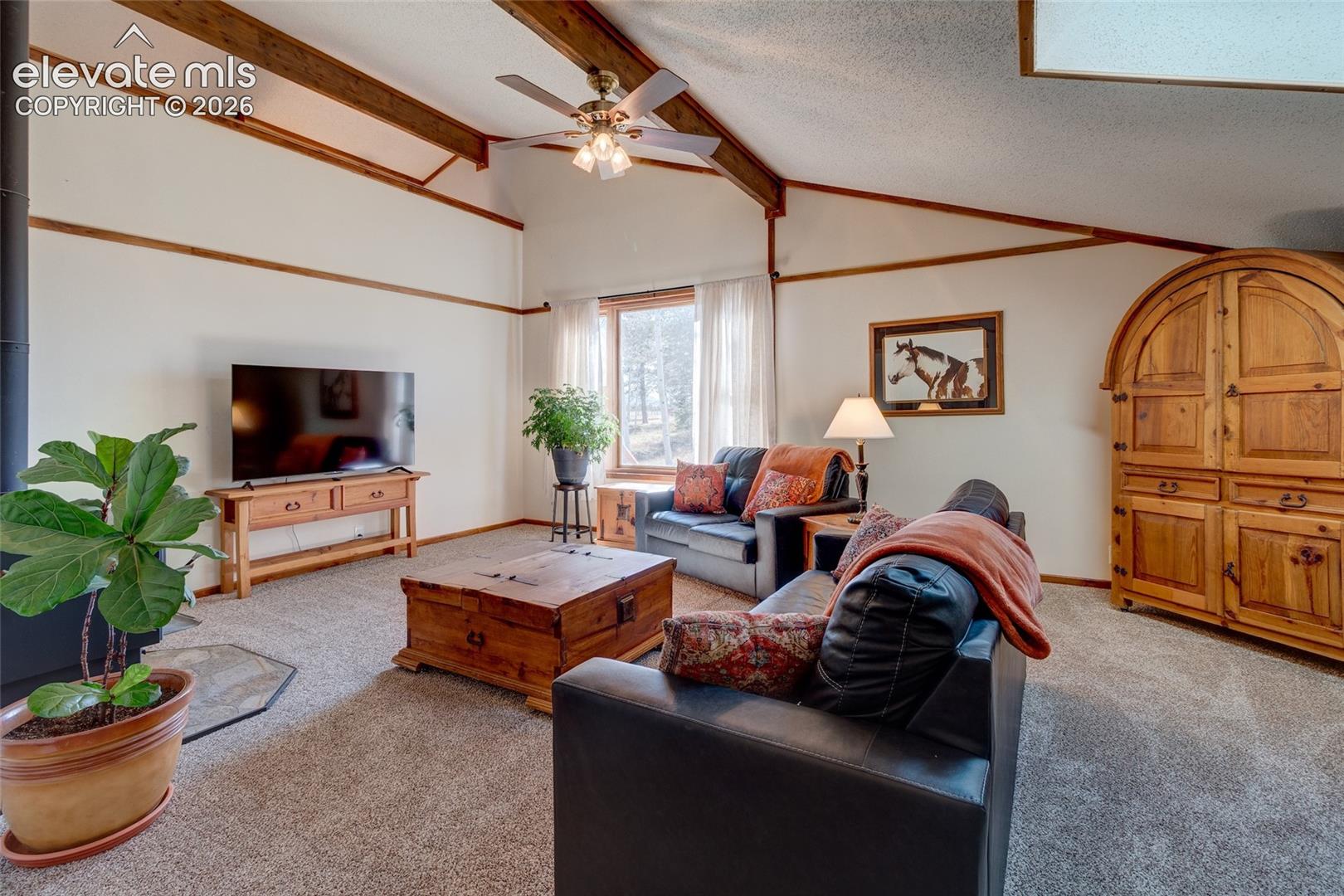 Living Room with vaulted beamed ceilings