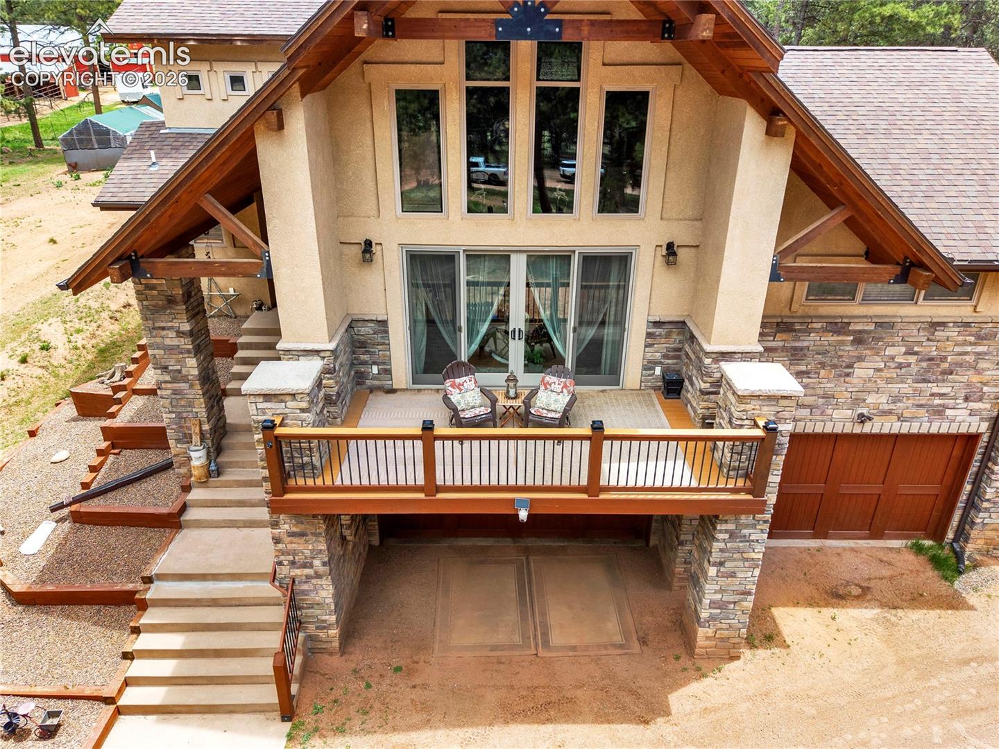 Looking down on the front deck that walks out from the living room