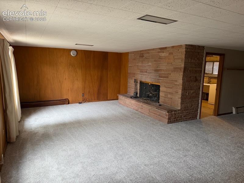 Family room (walk out) in the basement features a wood burning fireplace.