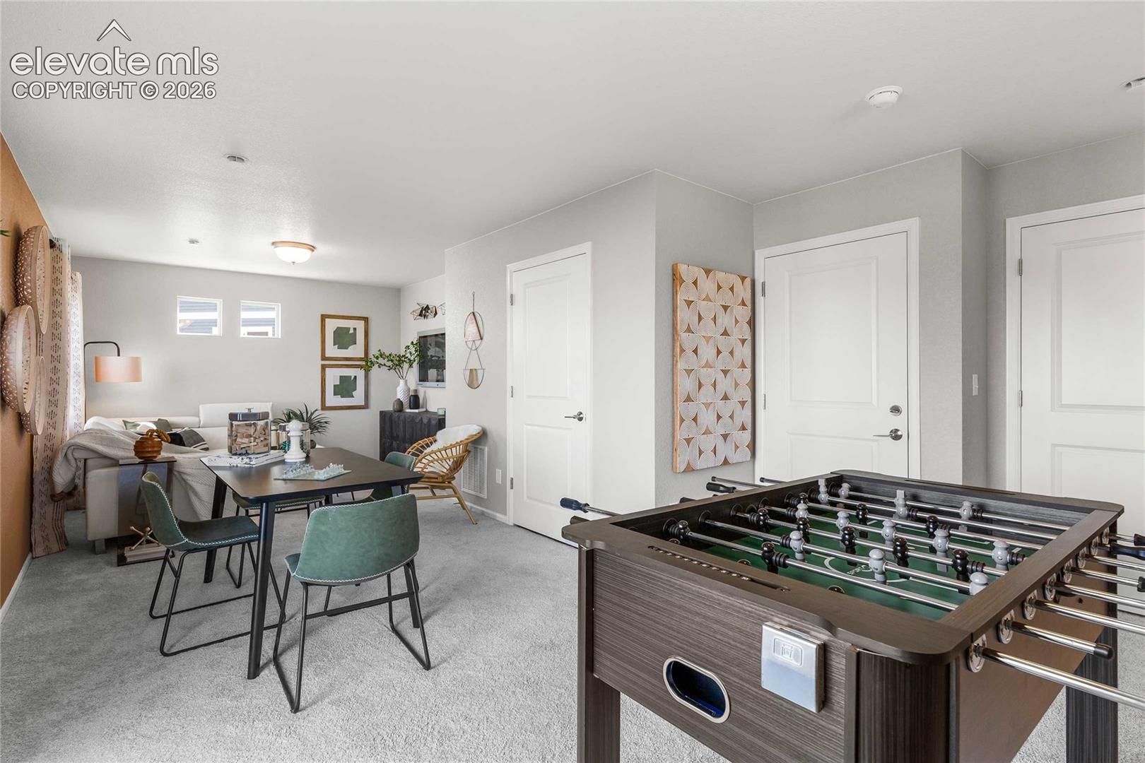Carpeted interior space with multiple white interior doors and recessed lighting
*photos of a model home*