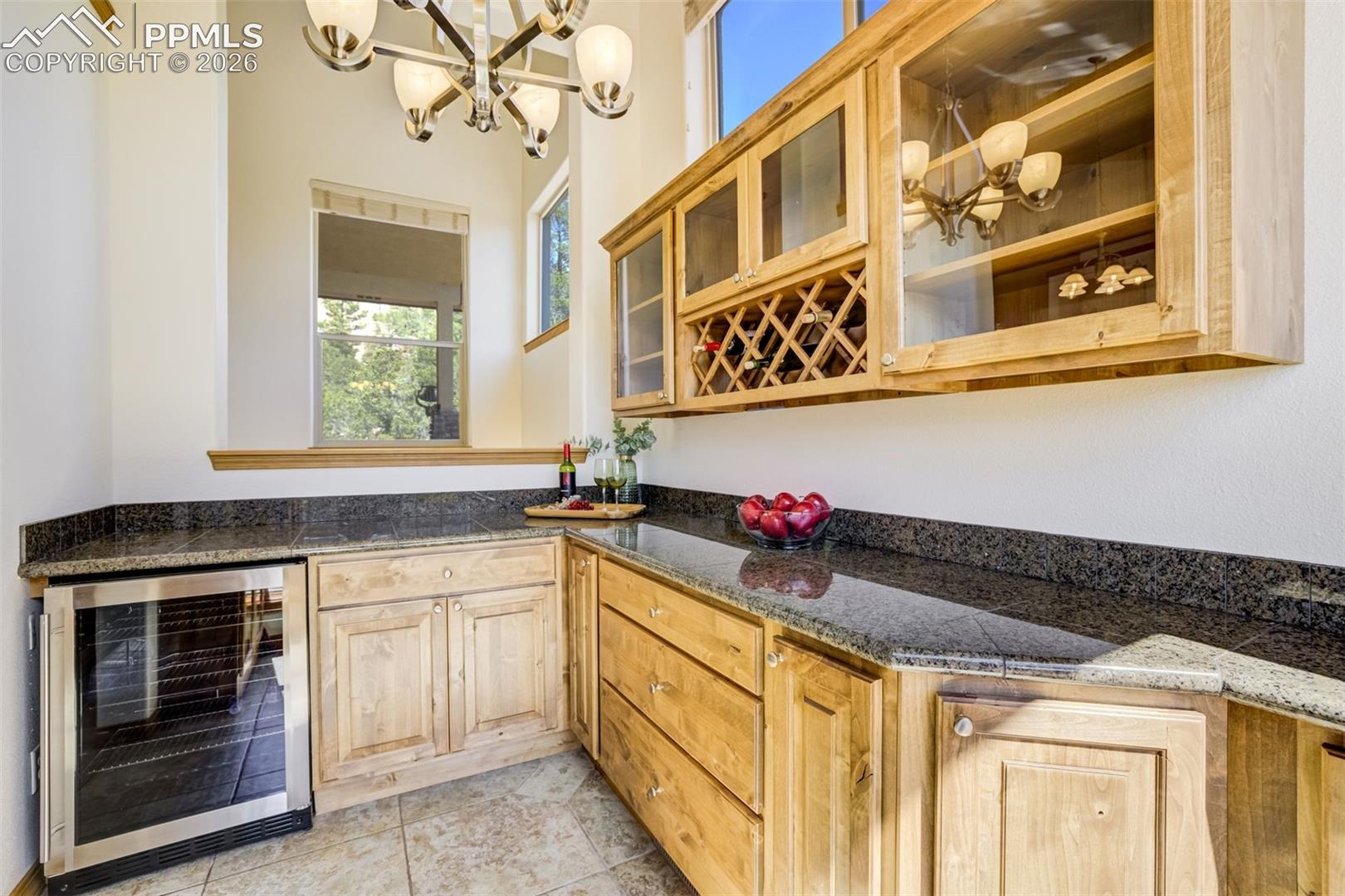 Butler's Pantry located off of the kitchen w/ wine refrigerator