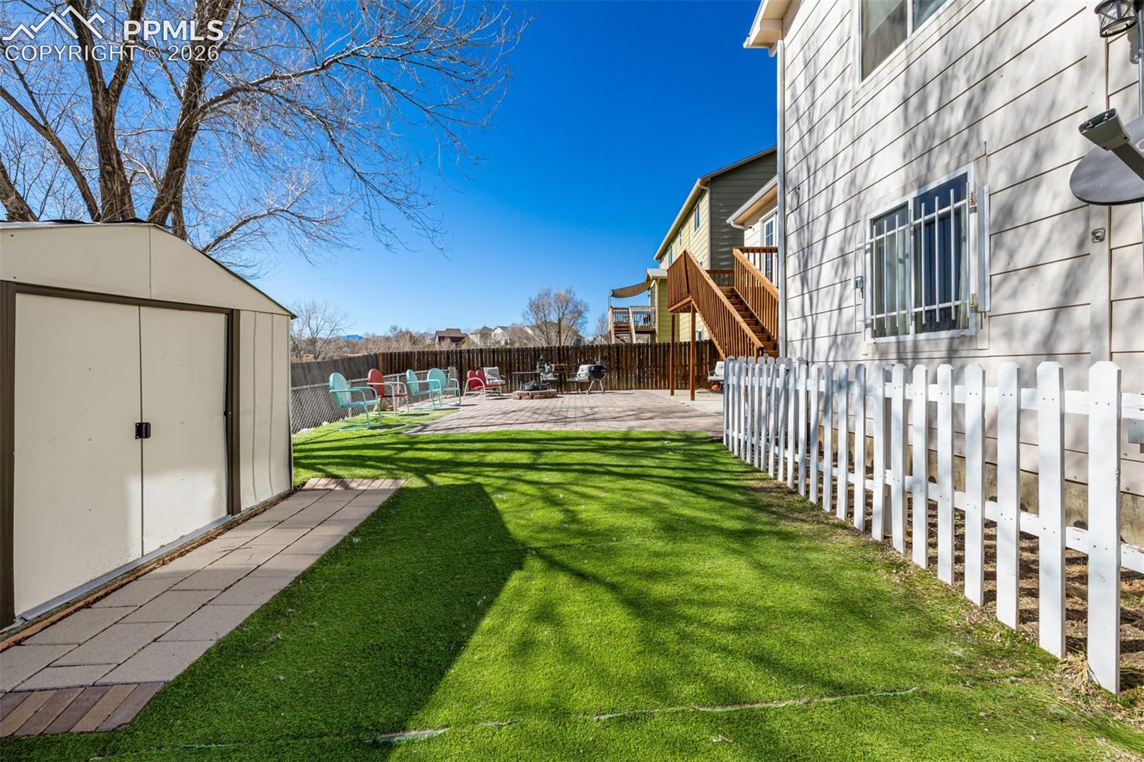 Xeriscaped Backyard and Spacious Storage Shed