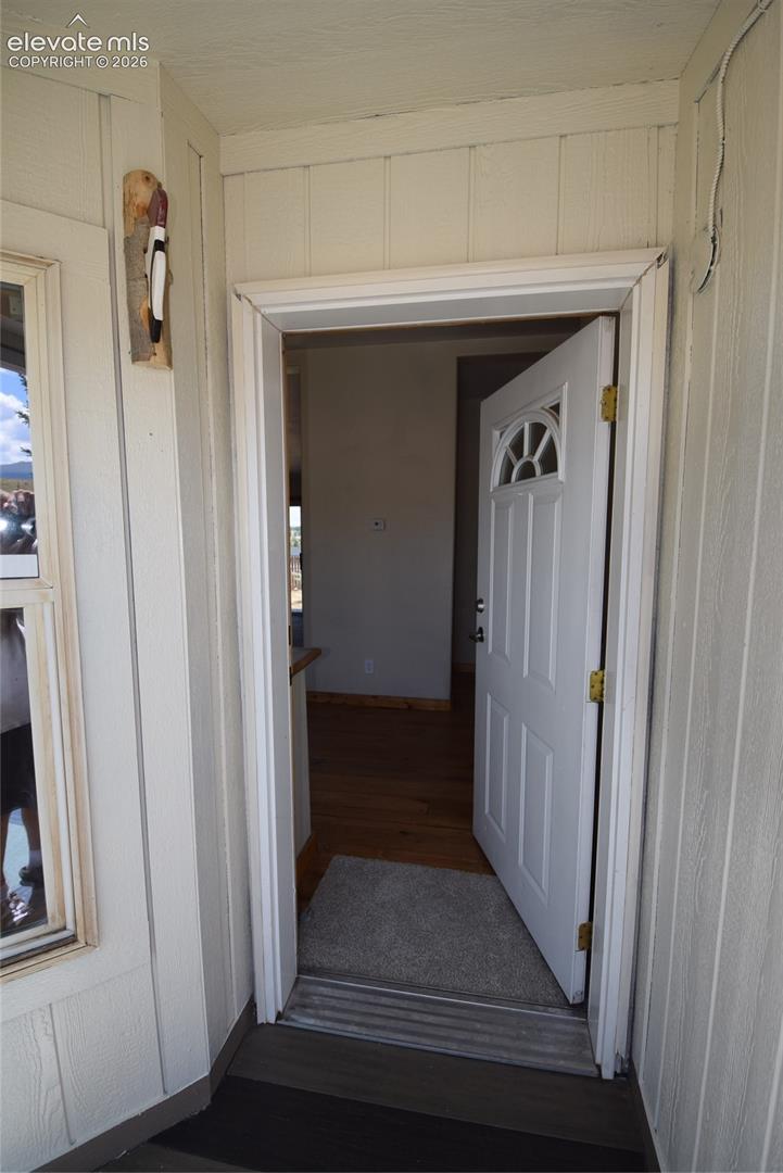 White paneled exterior siding with contrasting trim