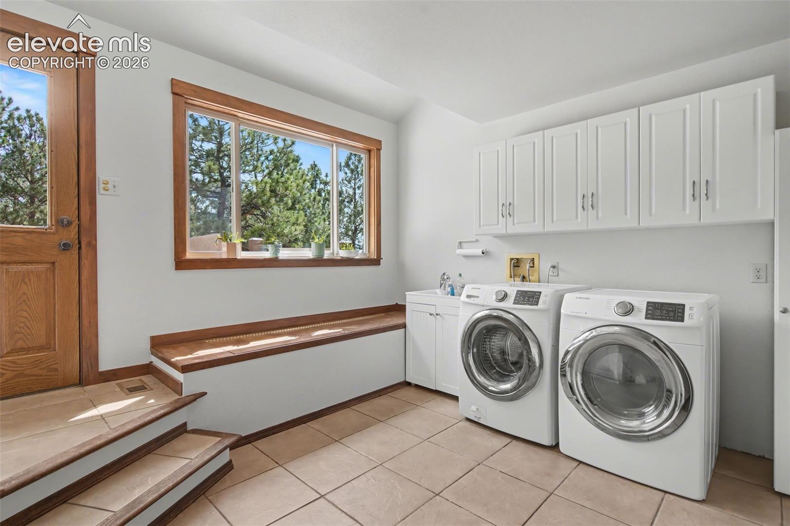 Laundry/mudroom with side patio entry!