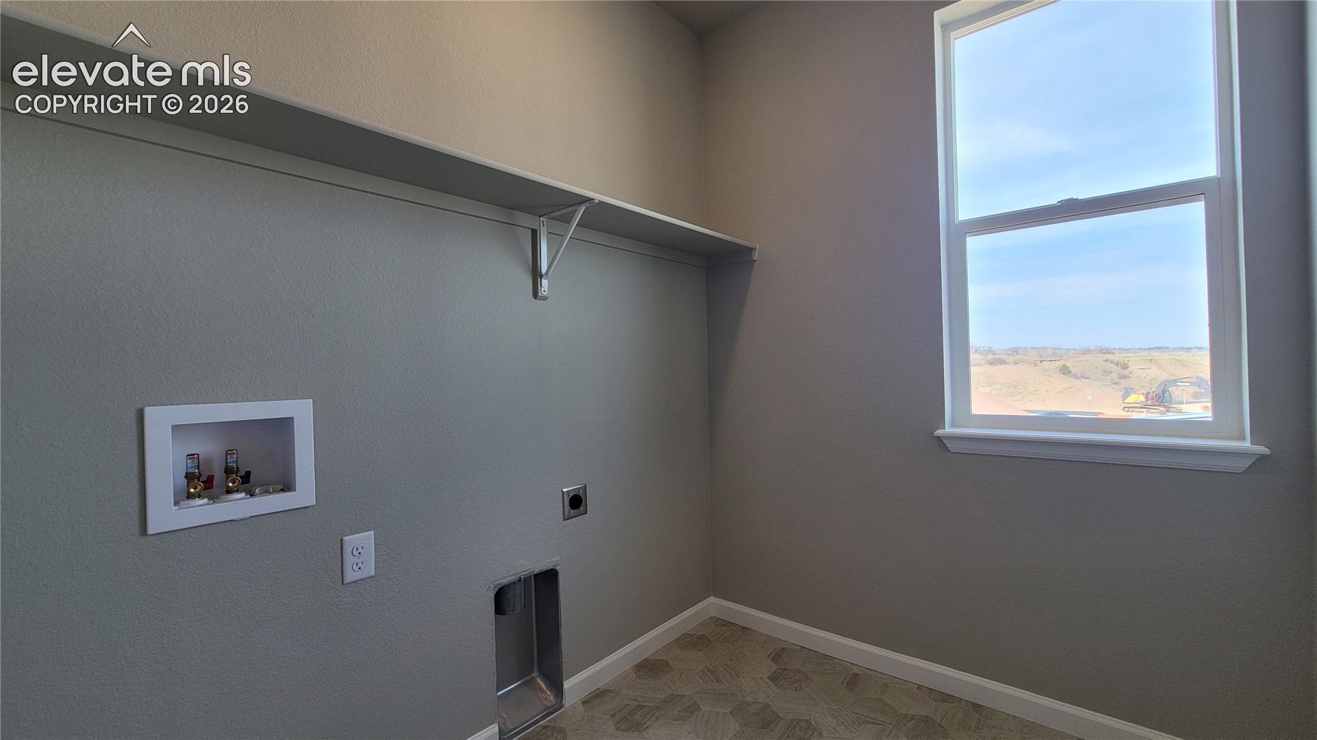 Conveniently located laundry room on the upper level with a window! 
