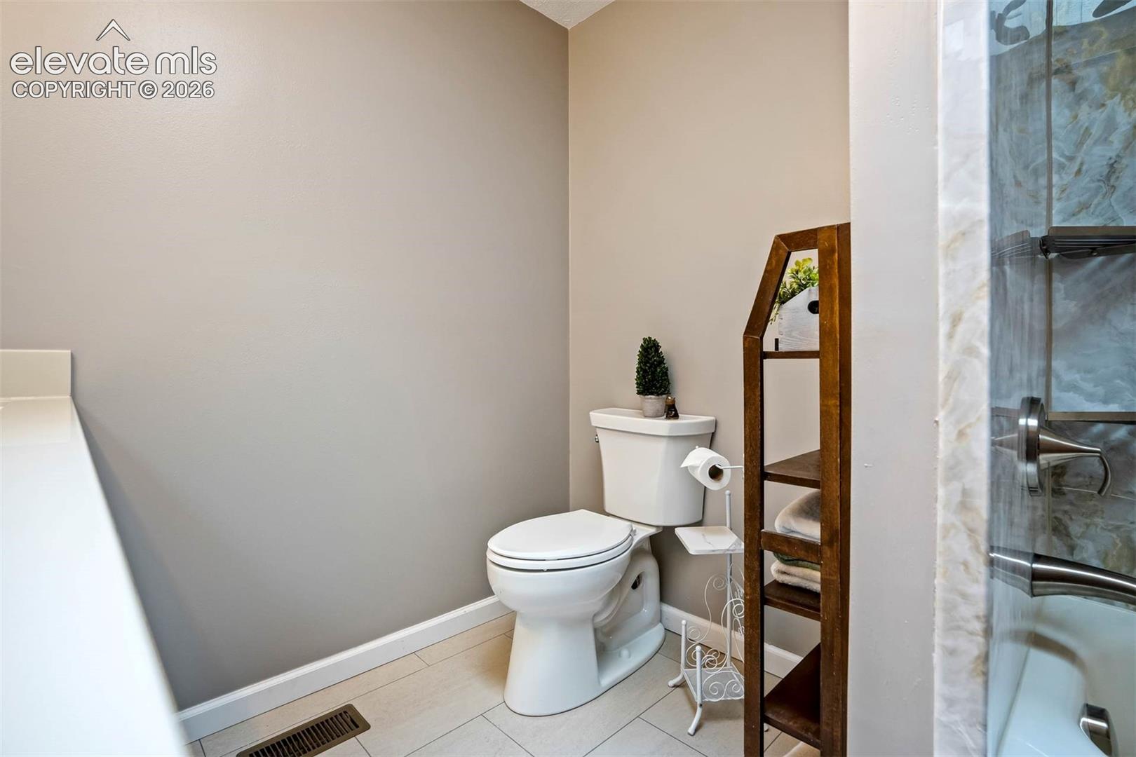 Brand new full bathroom-main level hall, double sink/vanity, tiled flooring tub/shower 