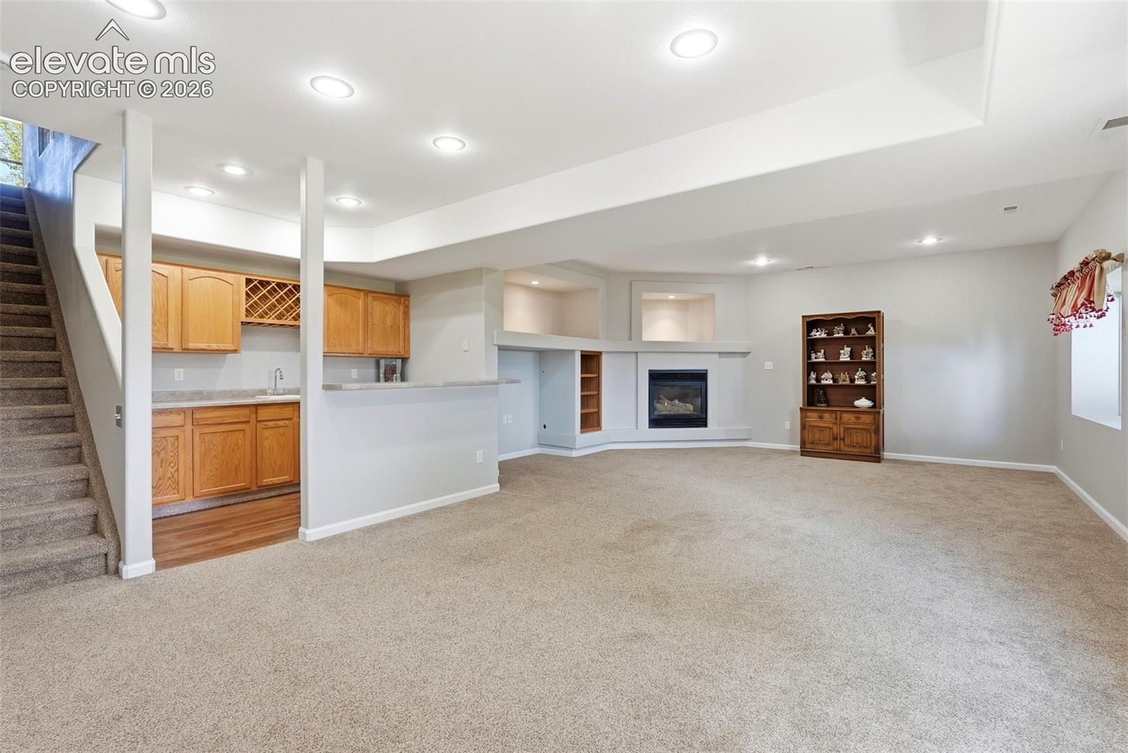 Basement rec/family room with wet bar & fireplace
