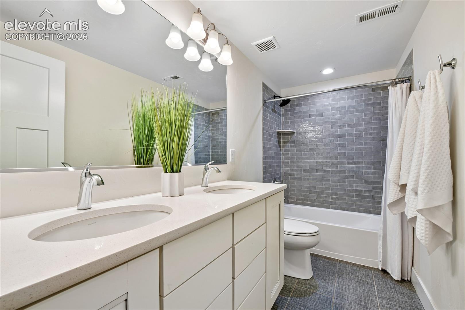 Lower level Full bath with quartz counters and double vanity