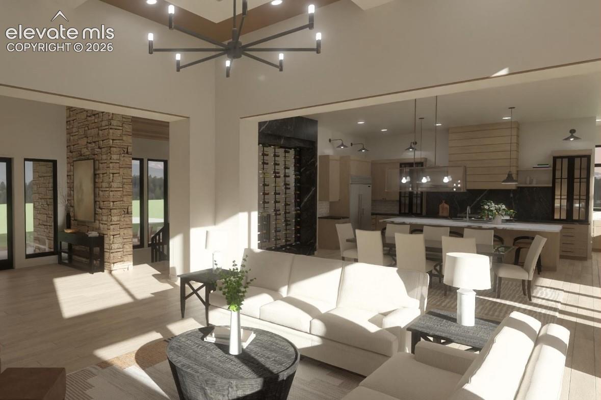 Spacious interior featuring high ceilings, wood-finish flooring and built-in wine rack