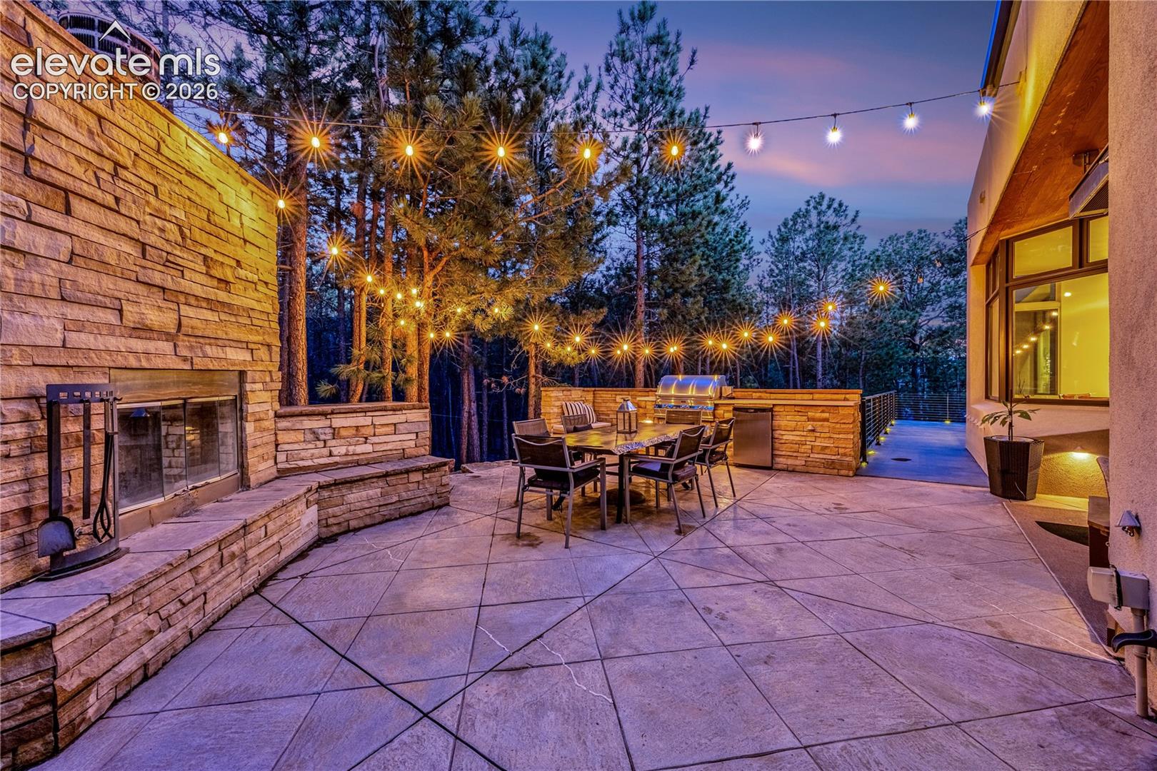 Side patio with built-in grill & fireplace