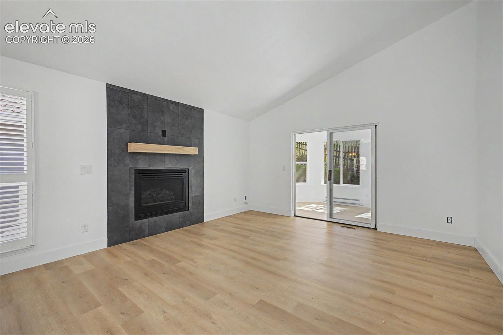 Living room with fireplace and attached sunroom