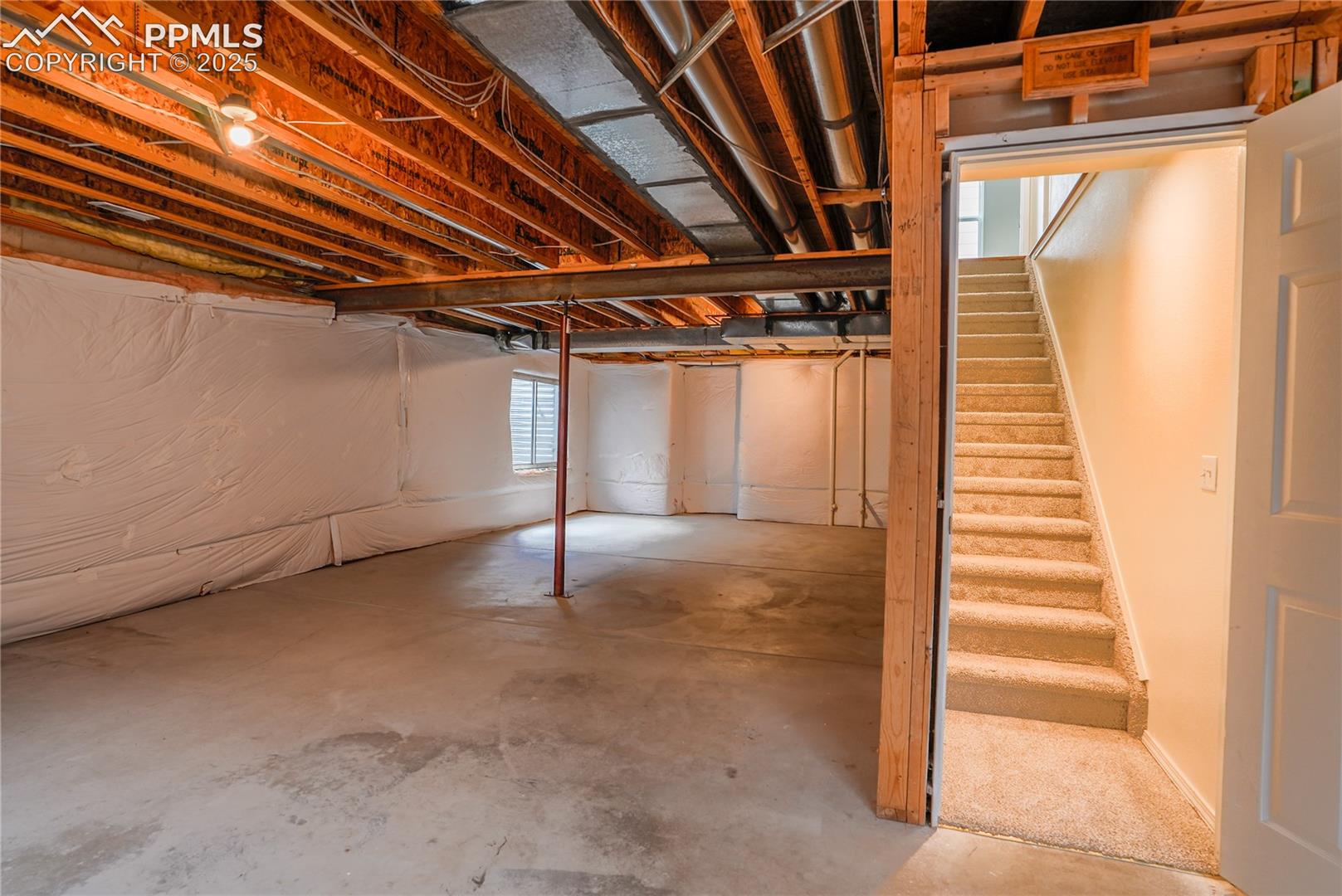 Basement featuring stairs