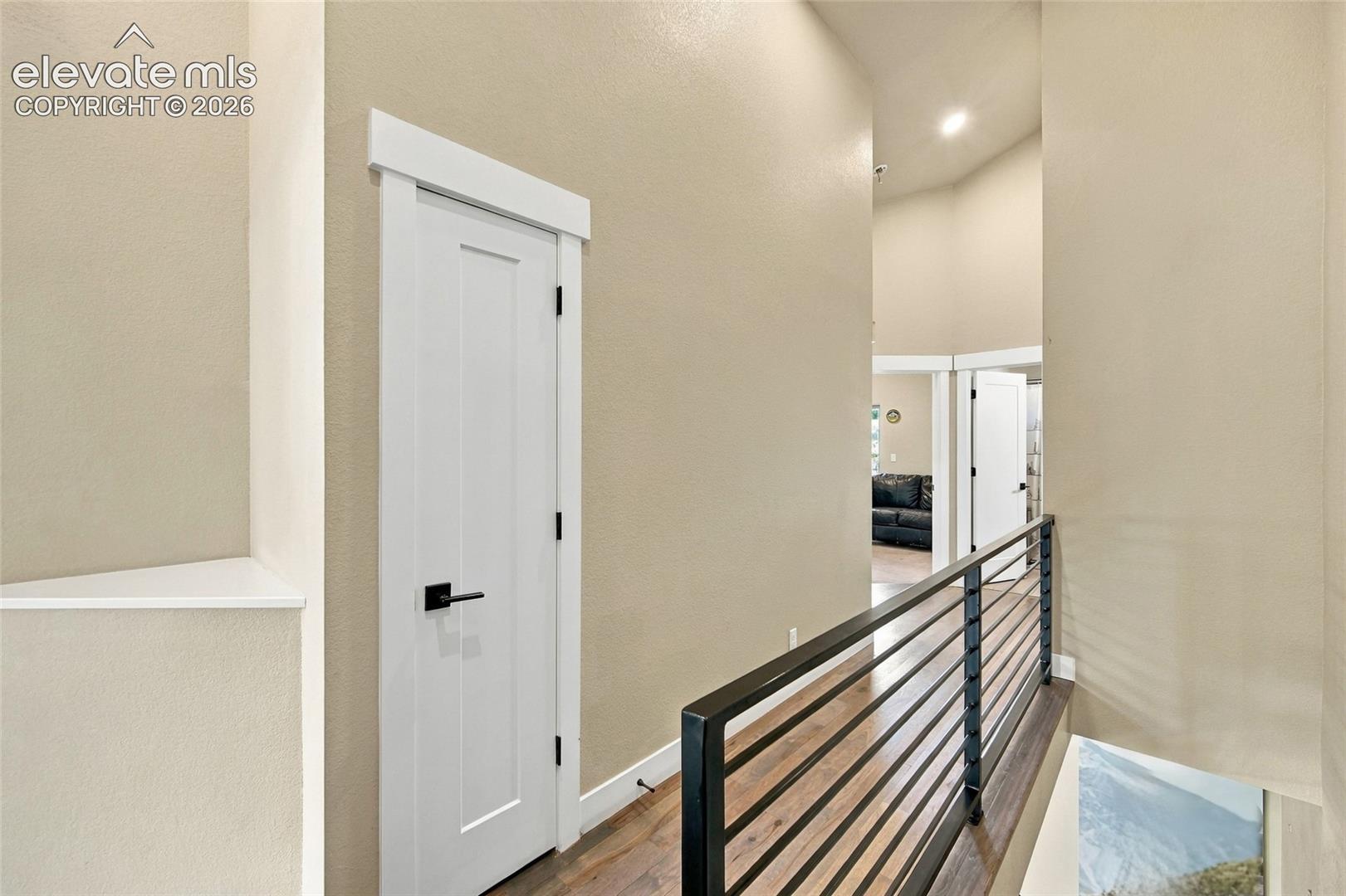 Upper level hall open to staircase