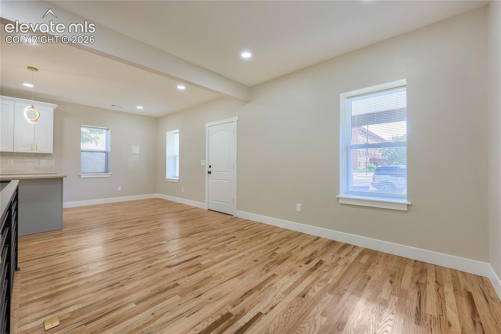 Another great view of the living and dining area, complete with gleaming wood floors!