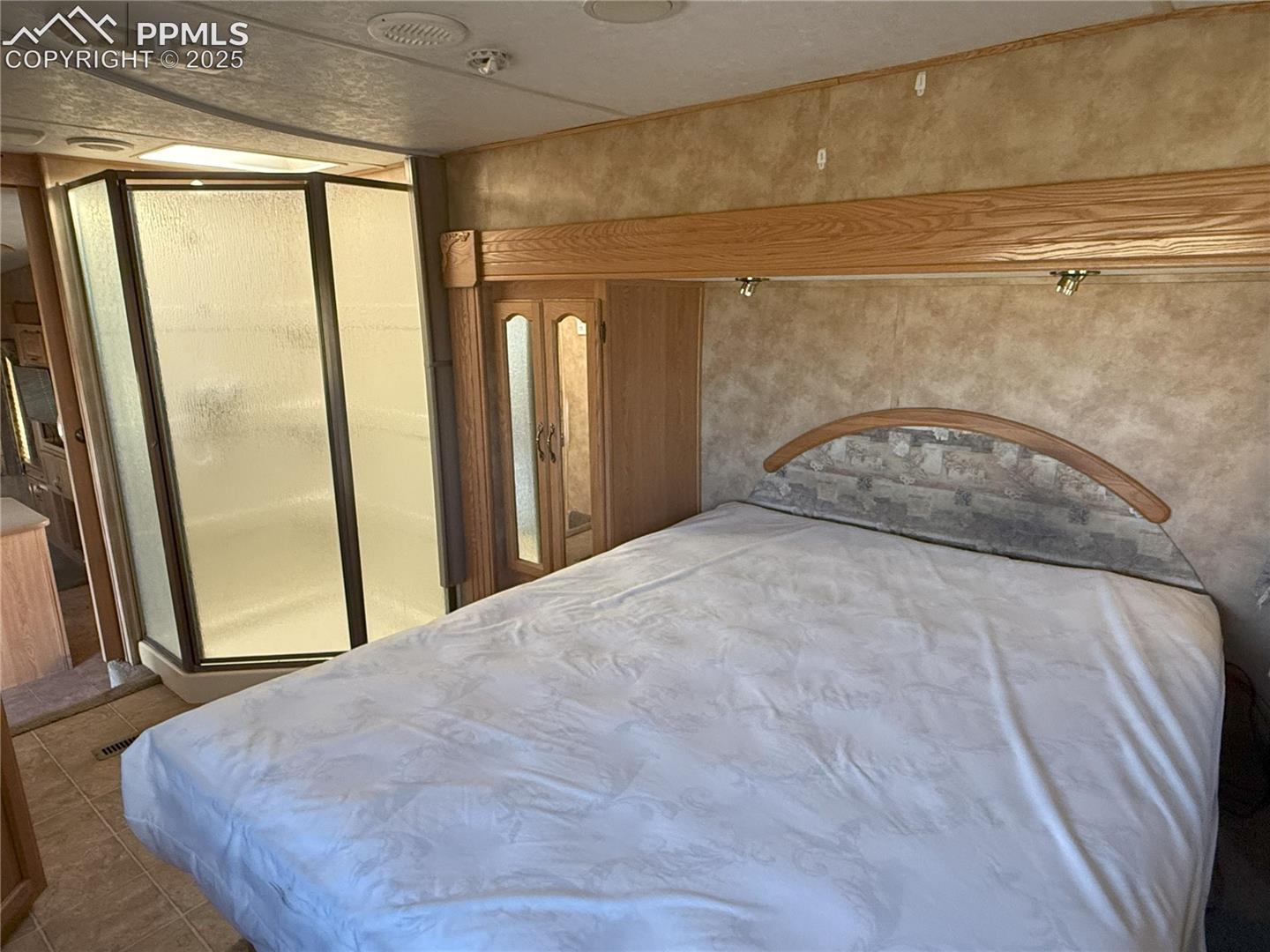 Bedroom featuring tile patterned floors