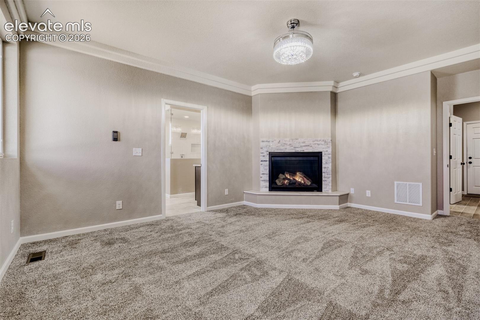 Primary Bedroom with fireplace, massive closet, lux 5-piece bath