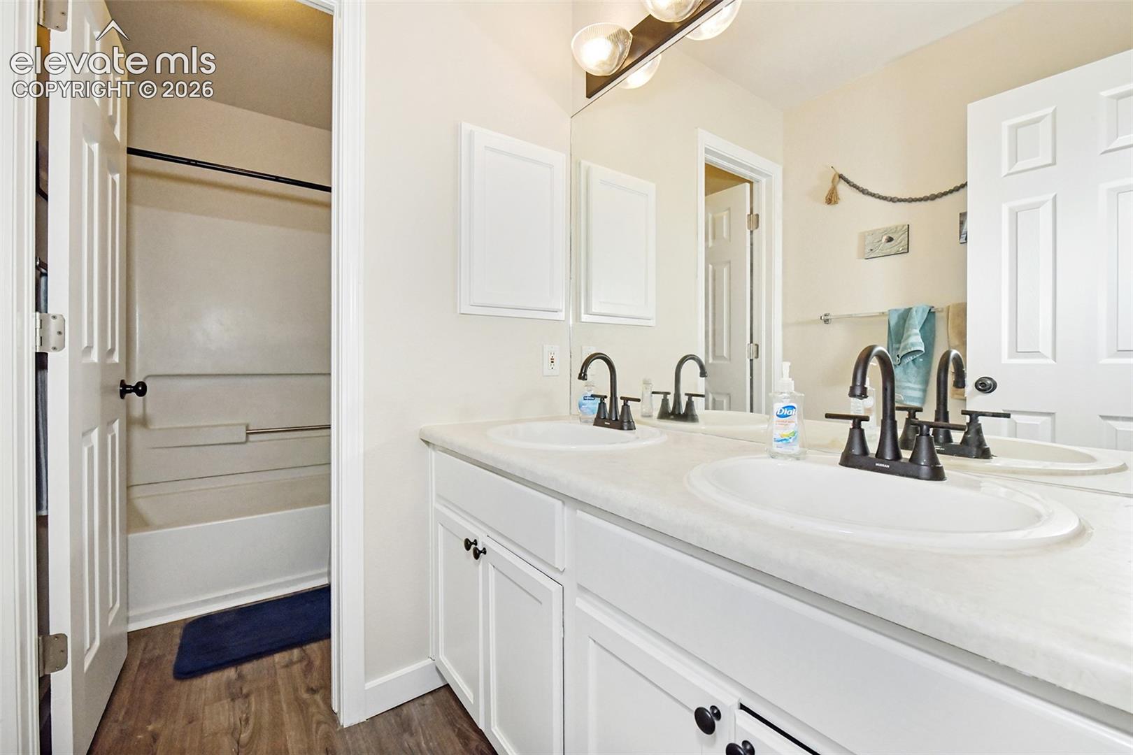 Main level bathroom with separate toilet/tub combo.