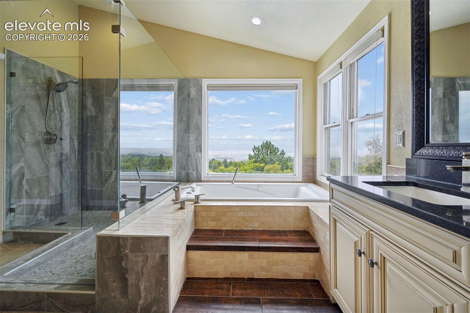 Designer primary bathroom with jet tub that overlooks the city!!!! 