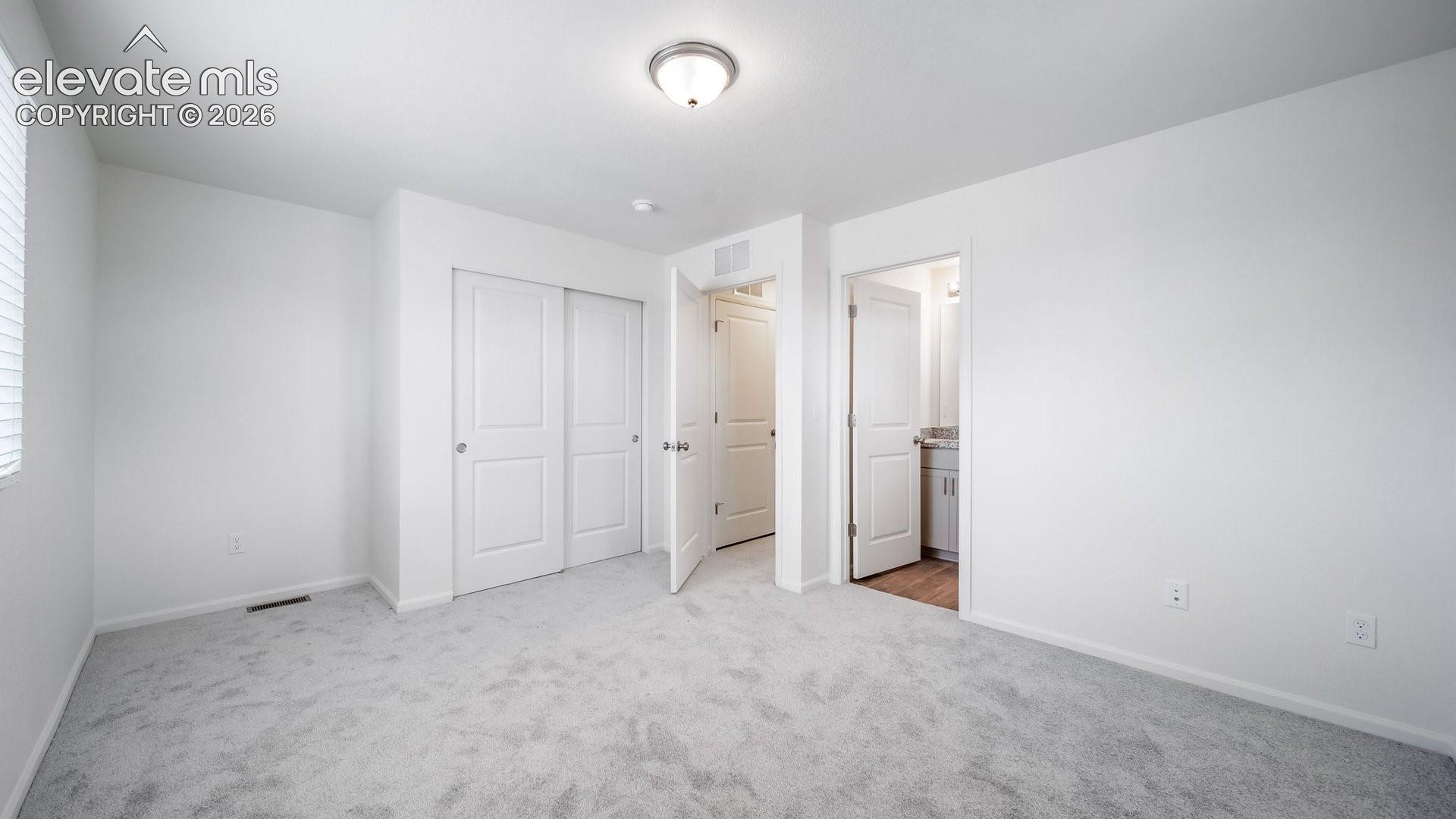 Light gray carpeting with white walls
*photos of a model home*