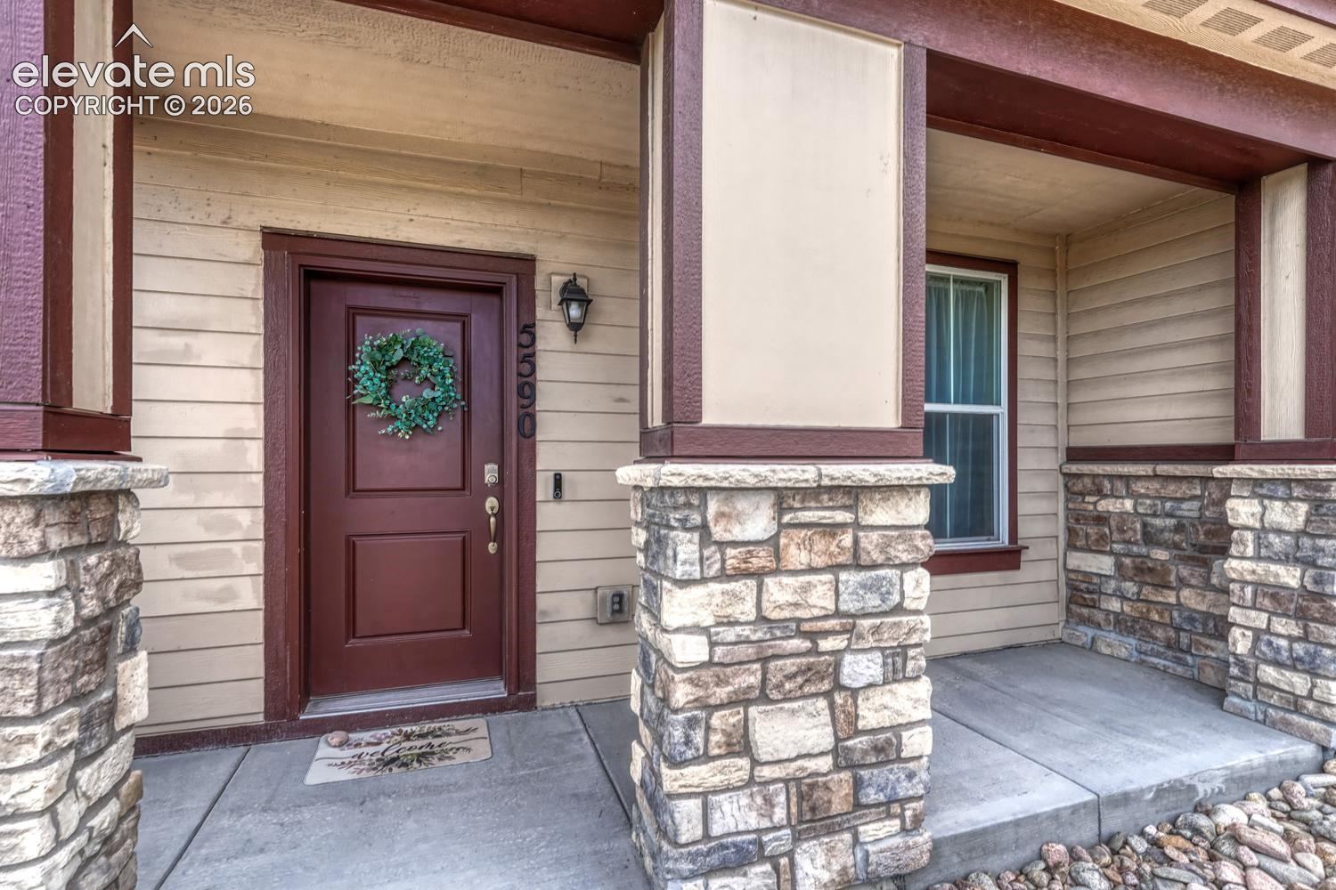 Enjoy peaceful open space views from the covered front porch, the perfect spot to relax! 