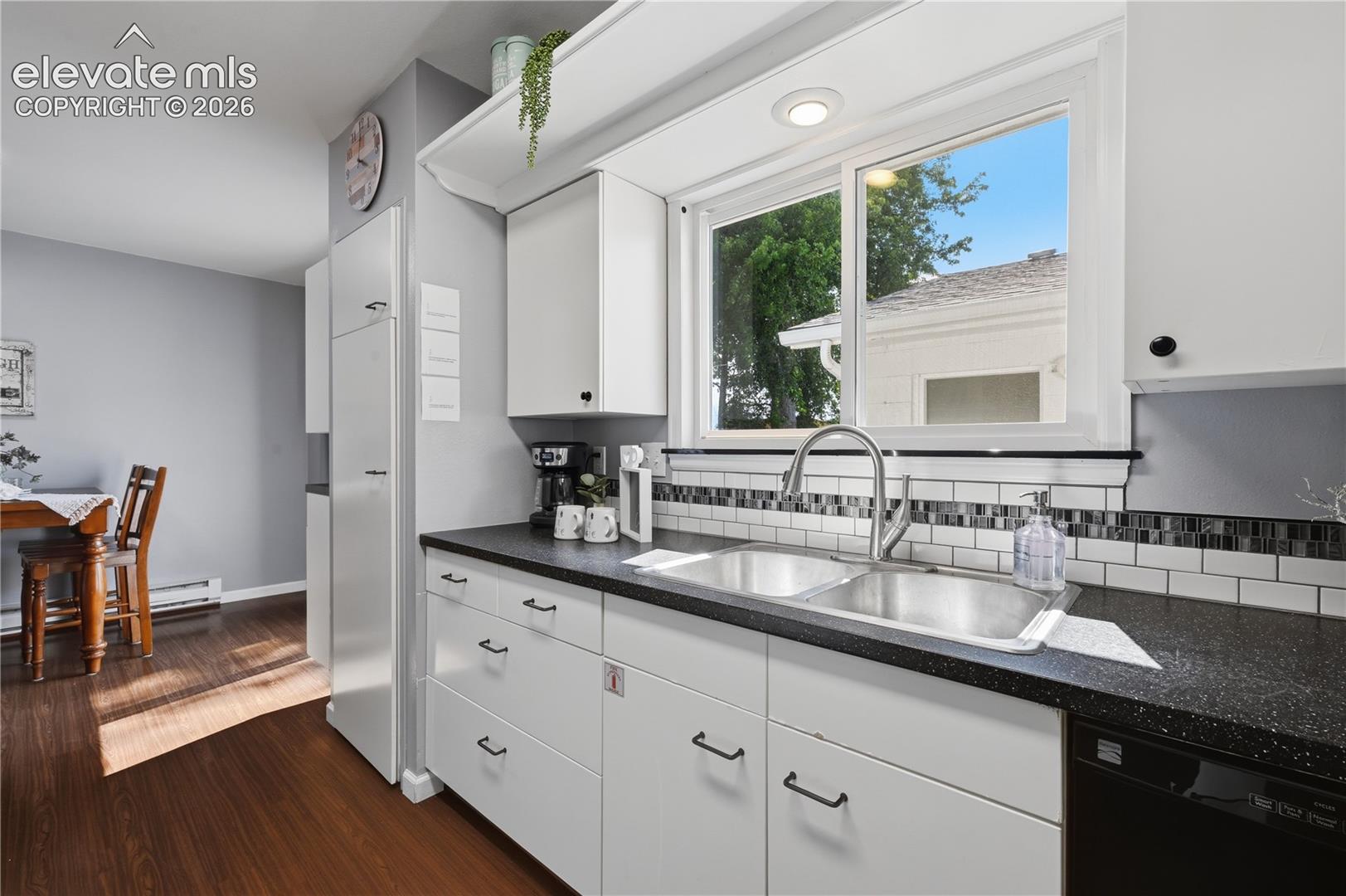 Modern galley style IKEA kitchen offers clean lines, generous cabinetry, and efficient workspace designed for everyday function.