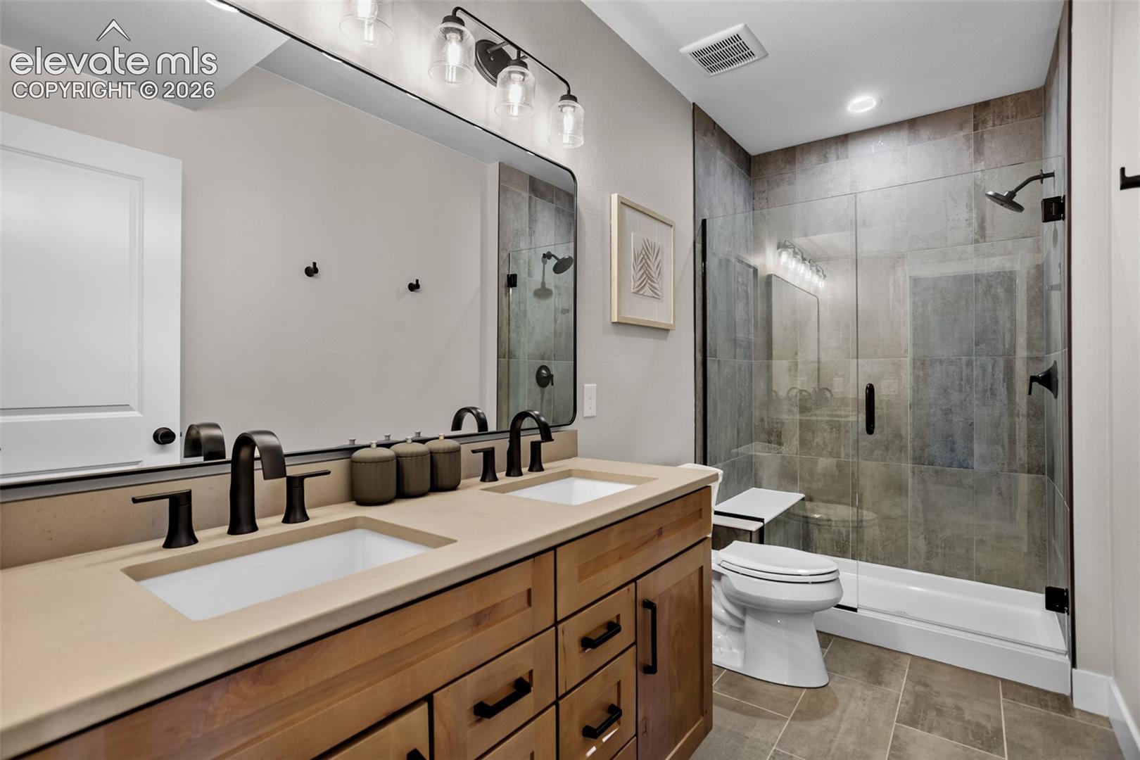 A double sink in the basement bathroom