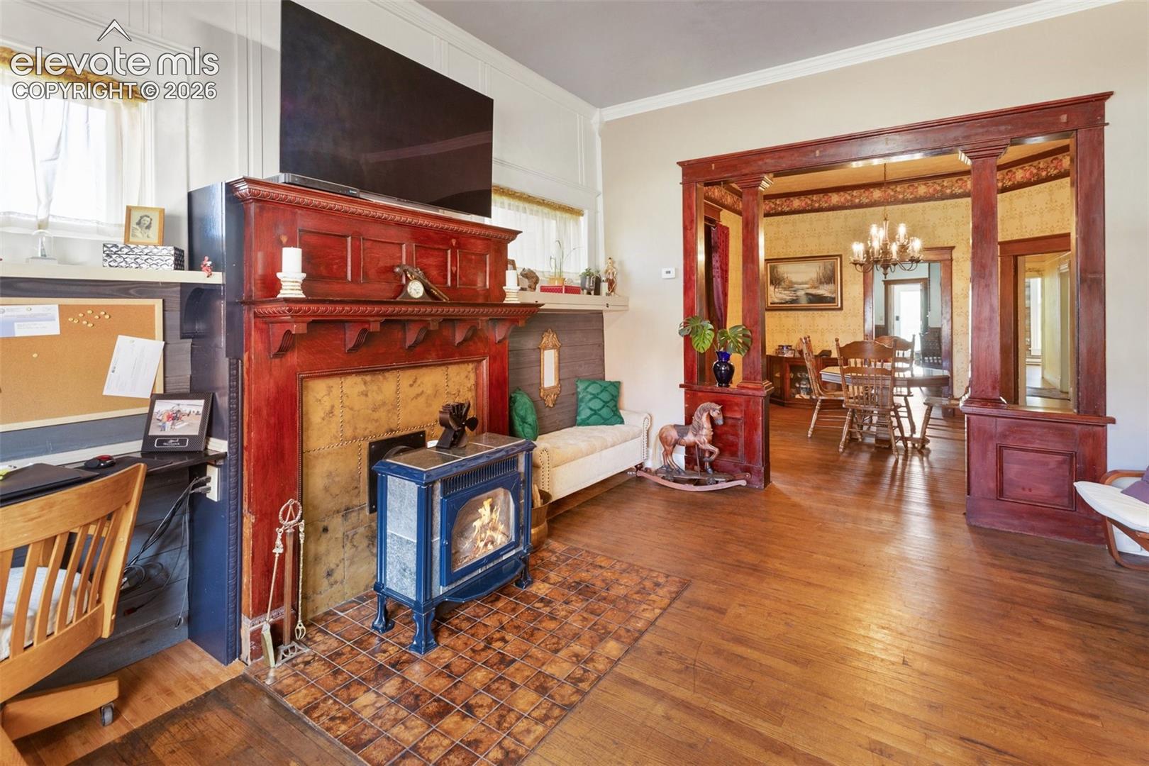 looking from east to west, you can see the dining table in the Dining Room to the west. Note the nicely refinshed wood floors, the tile in front of the stove and various other features adding style and functionalit
