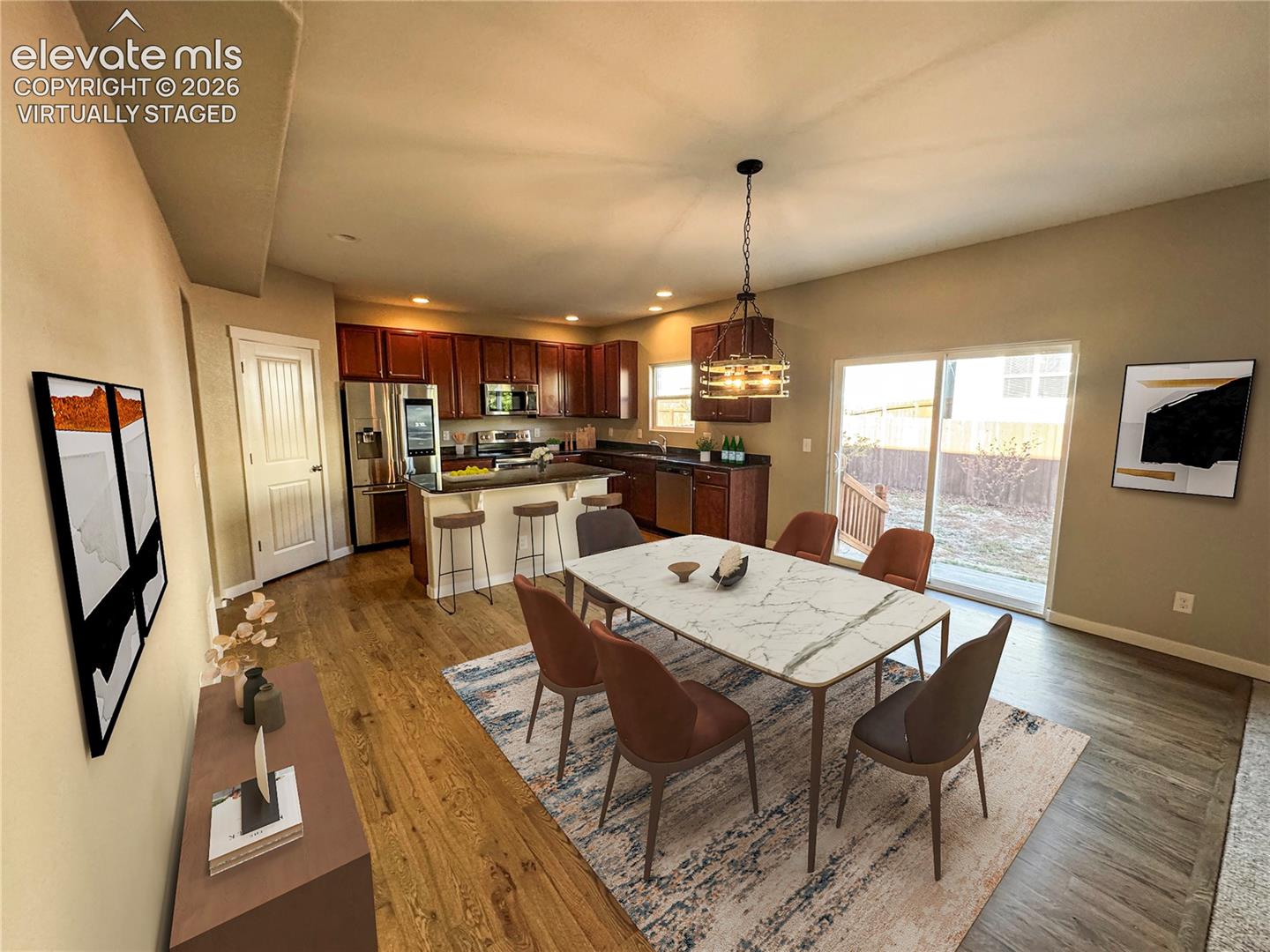 virtually staged Kitchen featuring wood-finish cabinetry, stainless steel appliances, a center island with bar seating, recessed lighting, and sliding glass doors