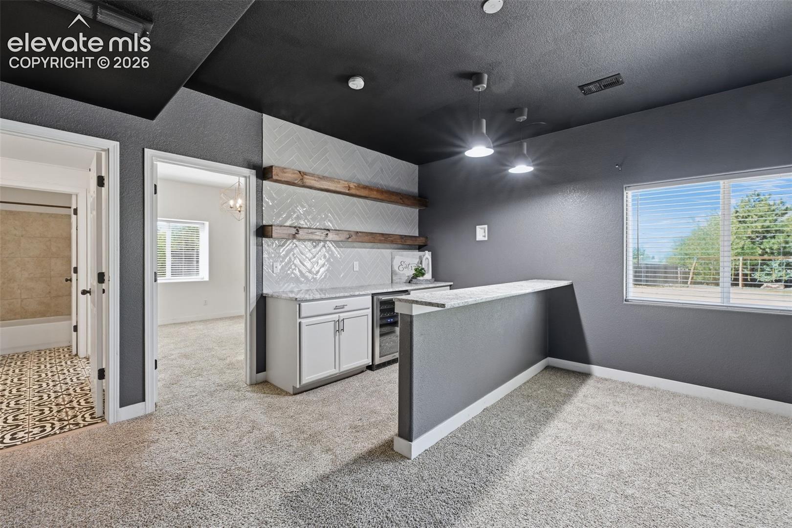 Walk out basement with wonderful wet bar and wincooler!