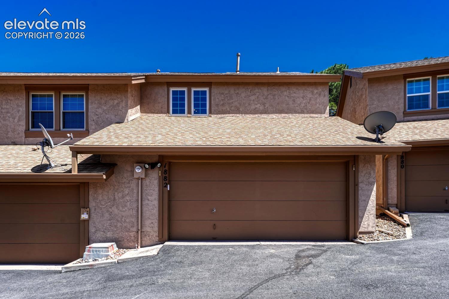 Over-sized 2-car garage with storage and a work area.