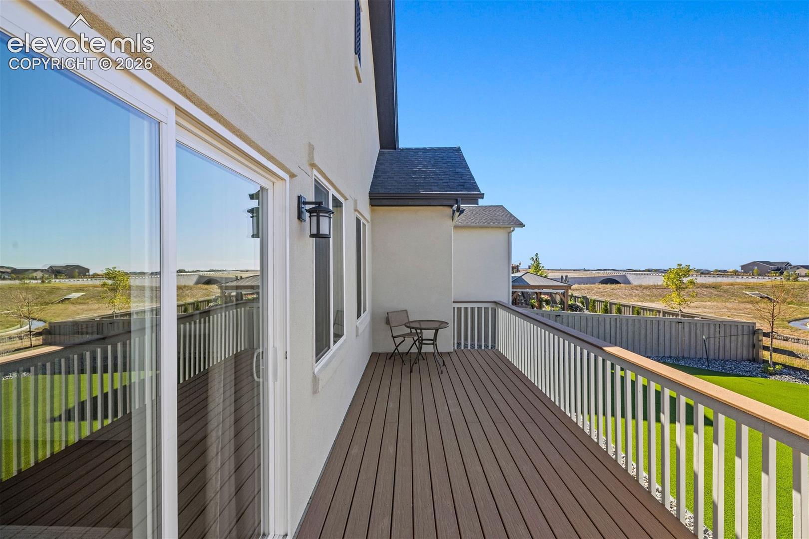 The open composite deck has incredible views of the green belt in the back and the Front Ranch. And the way the house next door is situated, you also have complete privacy as you enjoy the space. 