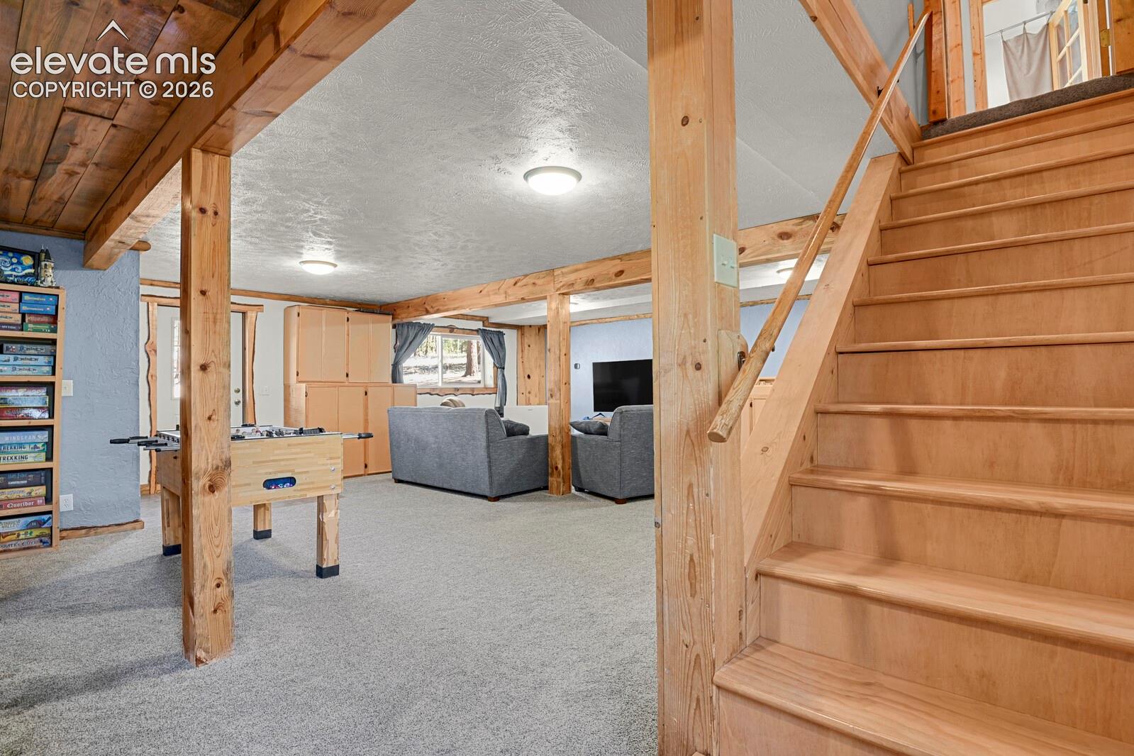 Downstairs family room with beetle kill accents throughout